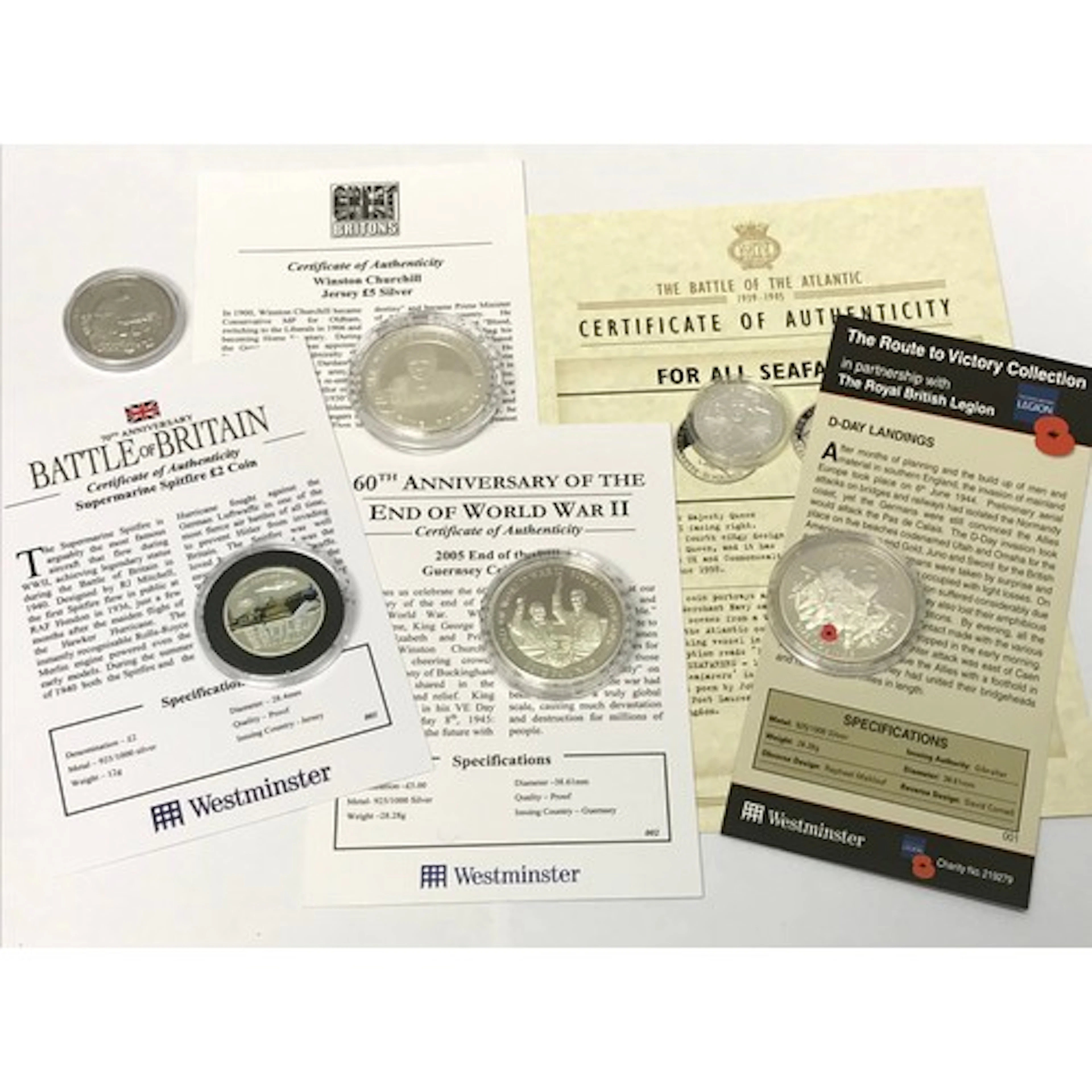 Three Elizabeth II WW2 commemorative silver £5 coins, Gibral...