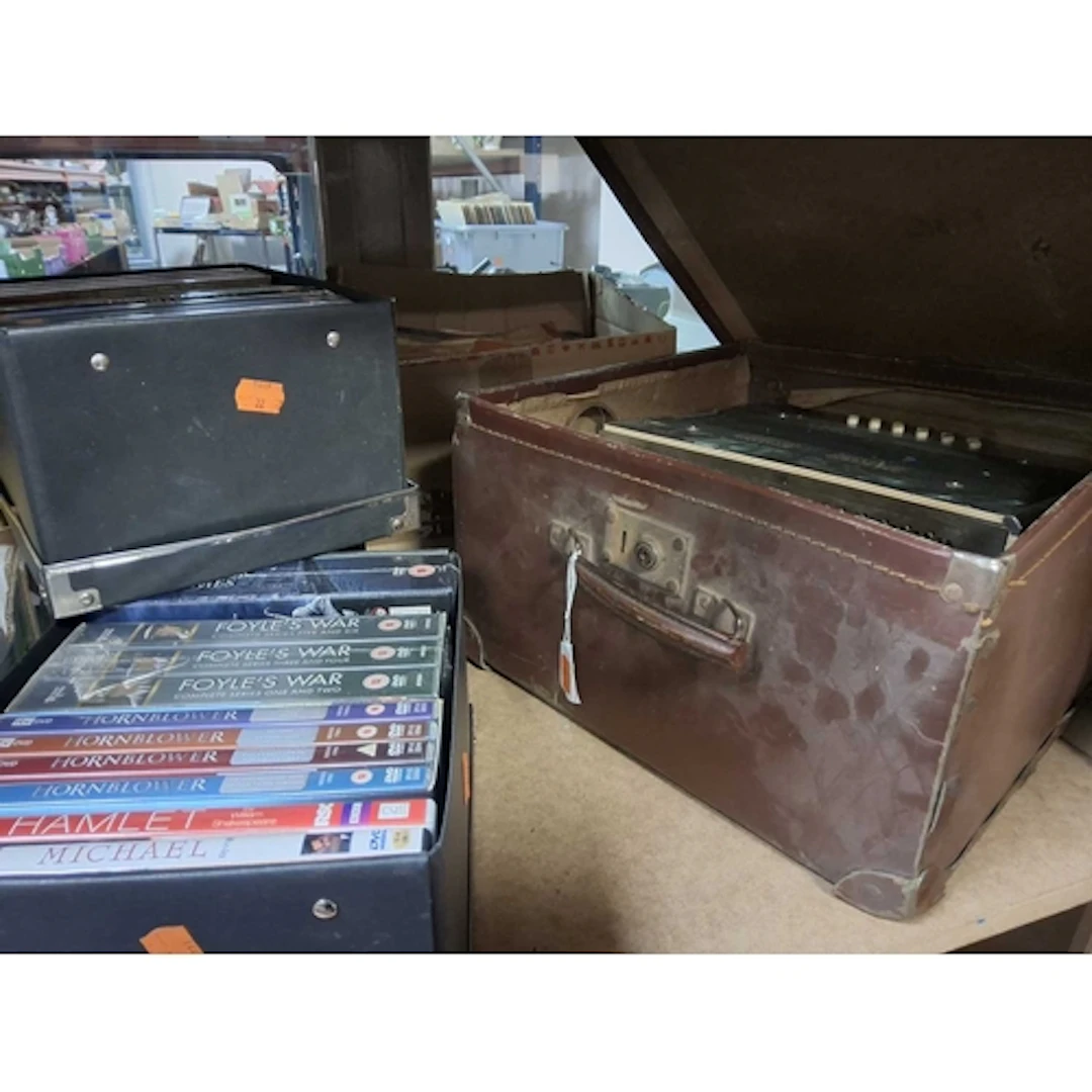 A GROUP OF DVDS, AN ACCORDION, AND RECORDS comprising four s...