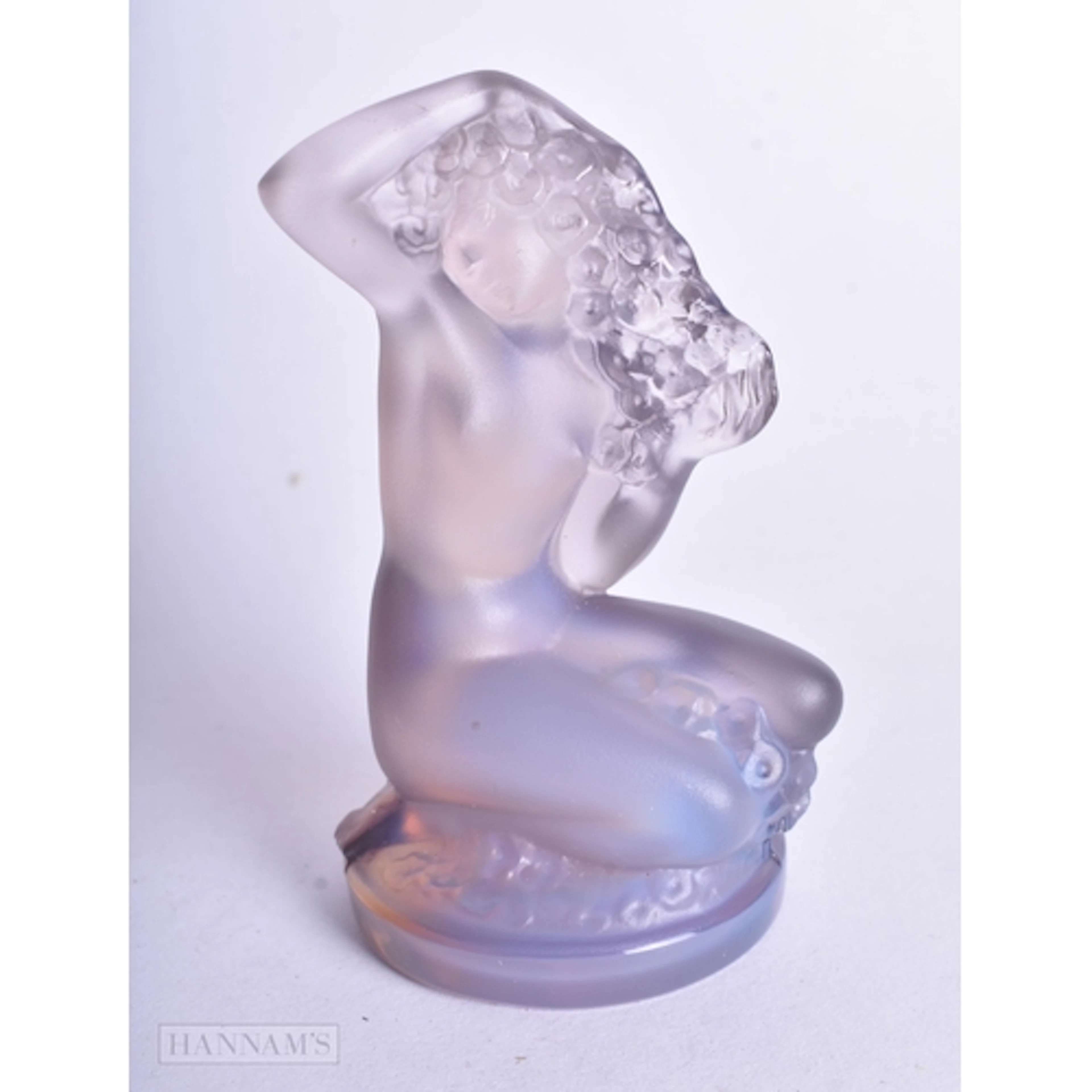 A LALIQUE IRIDESCENT GLASS NYMPH. 8 cm x 4.75 cm.
