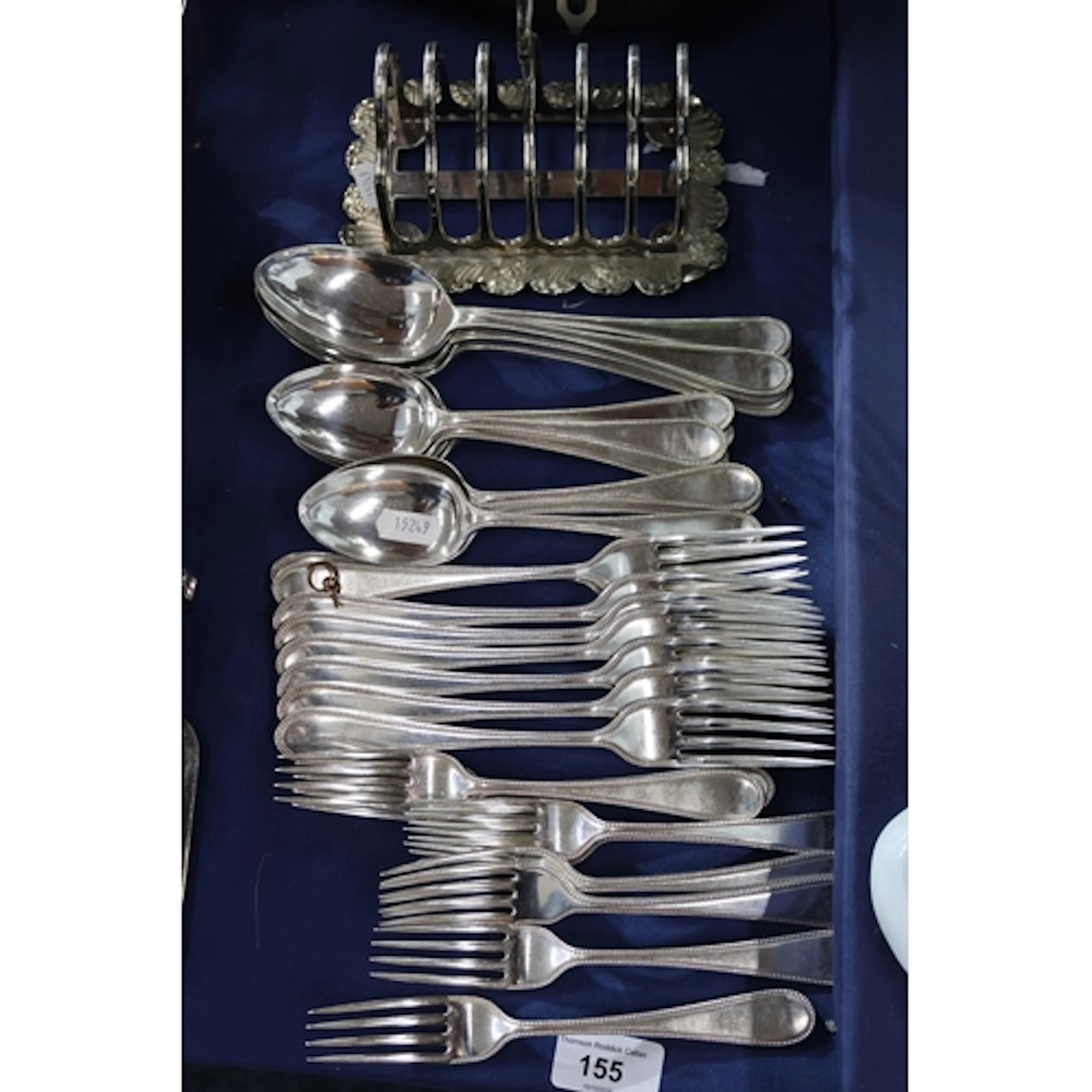 Flatware and toastrack.