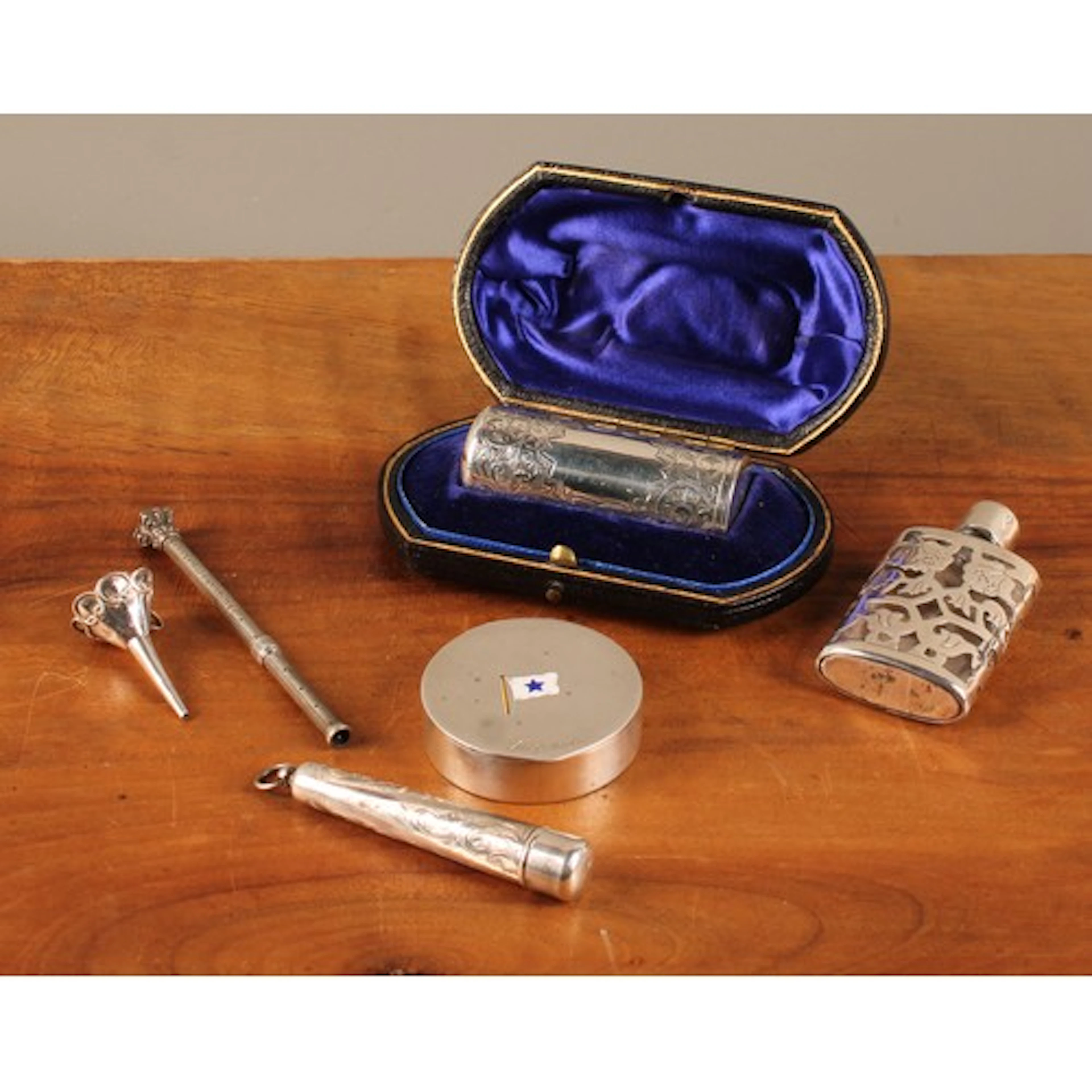 A Victorian silver cylindrical smelling salts bottle, engrav...