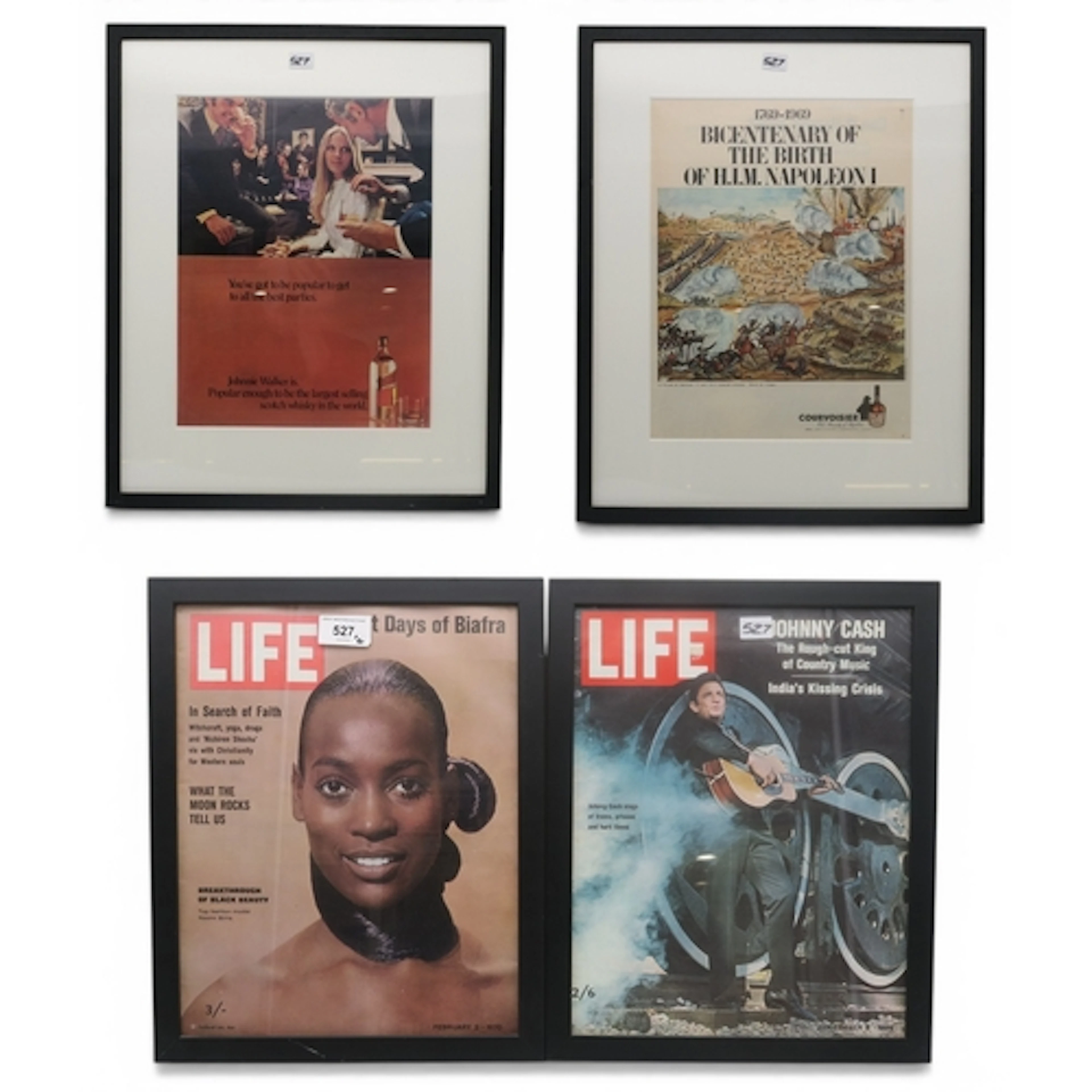 Two framed liquor advertisements, respectively Johnnie Walke...