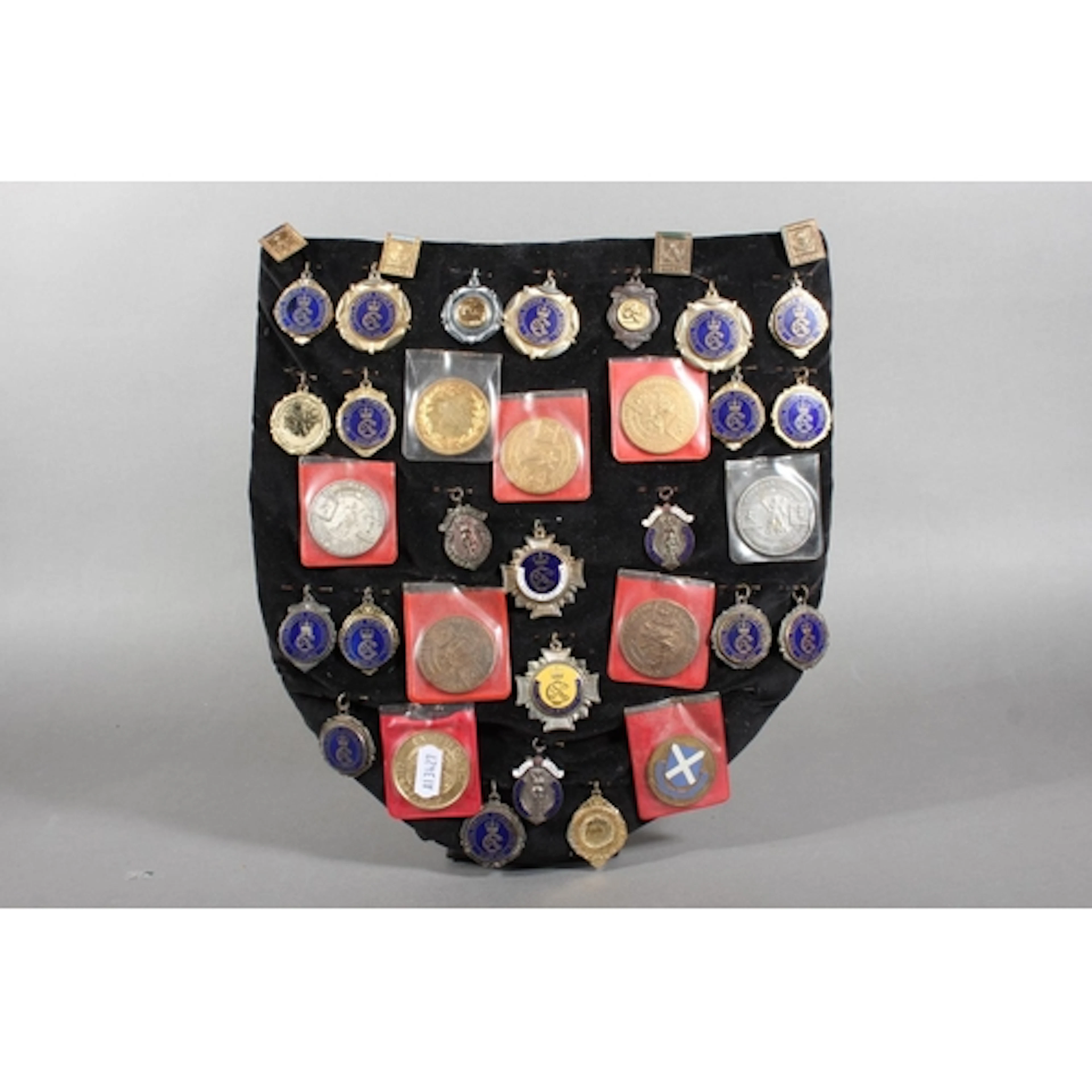 Shield containing Athletic and Sports award fob medals to in...