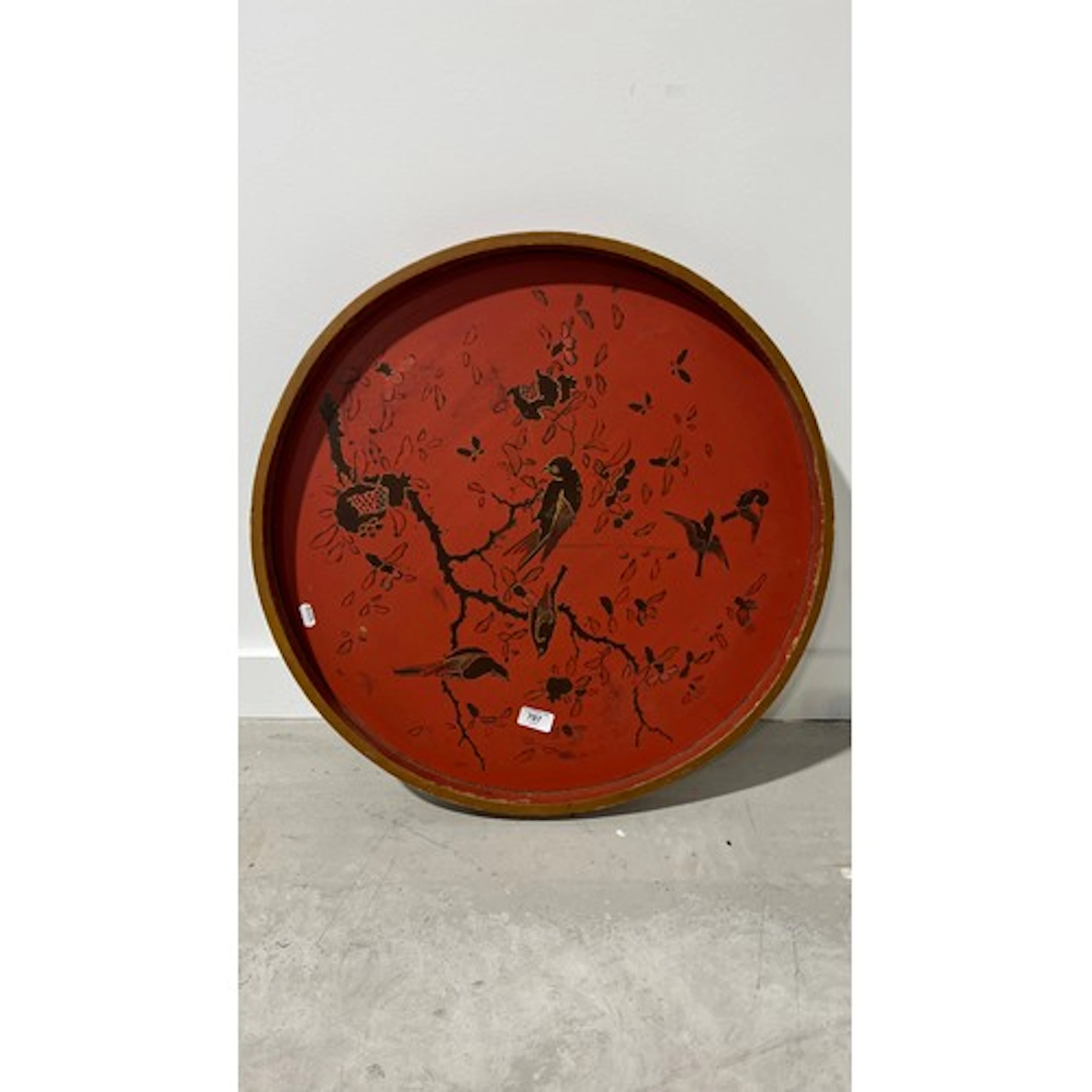 Red lacquered tray decorated with birds and blossom, 62cm di...