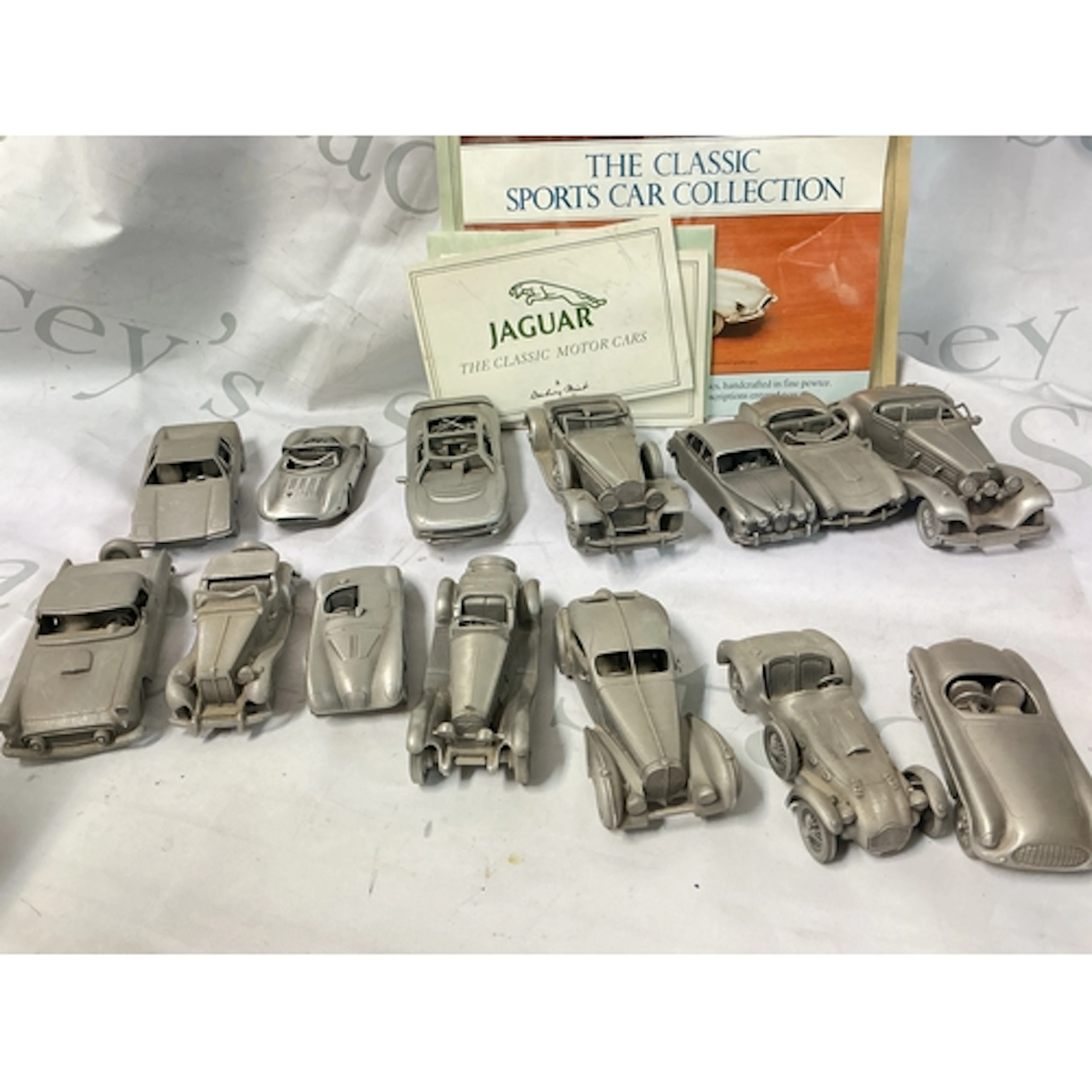 A Collection Of approximately 40 Danbury Mint Pewter Cars.