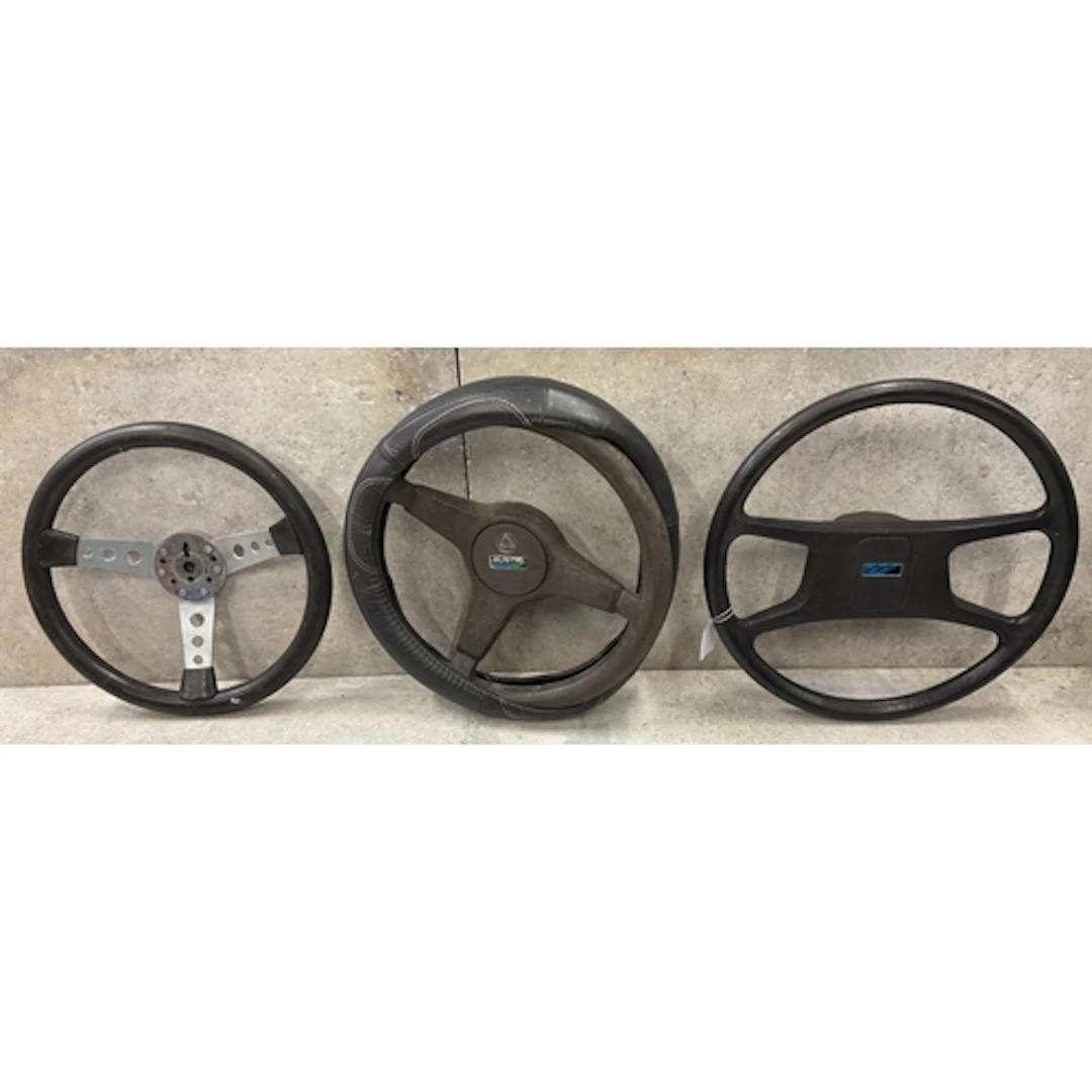 An Austin Mini Metro steering wheel together with two other ...
