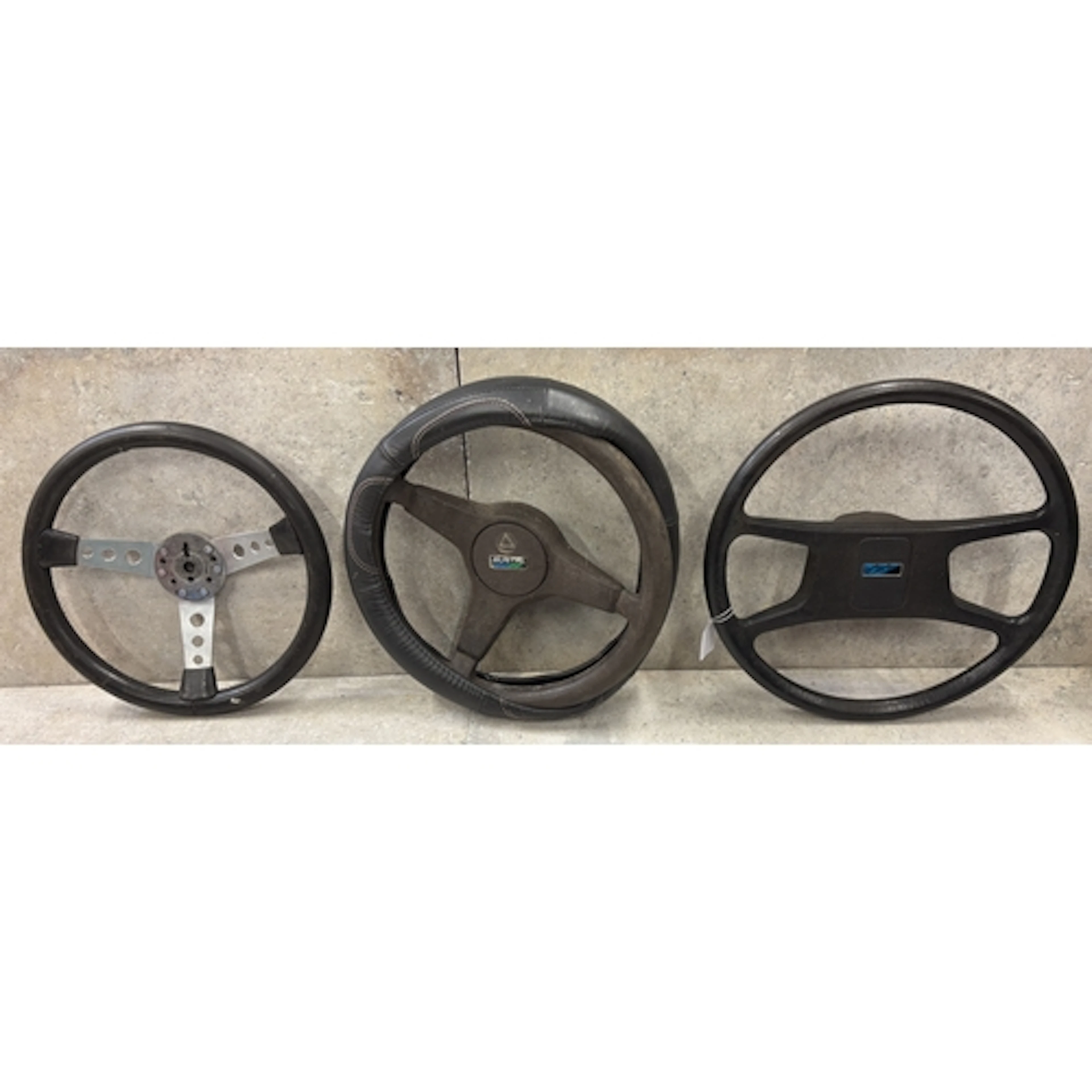 An Austin Mini Metro steering wheel together with two other ...