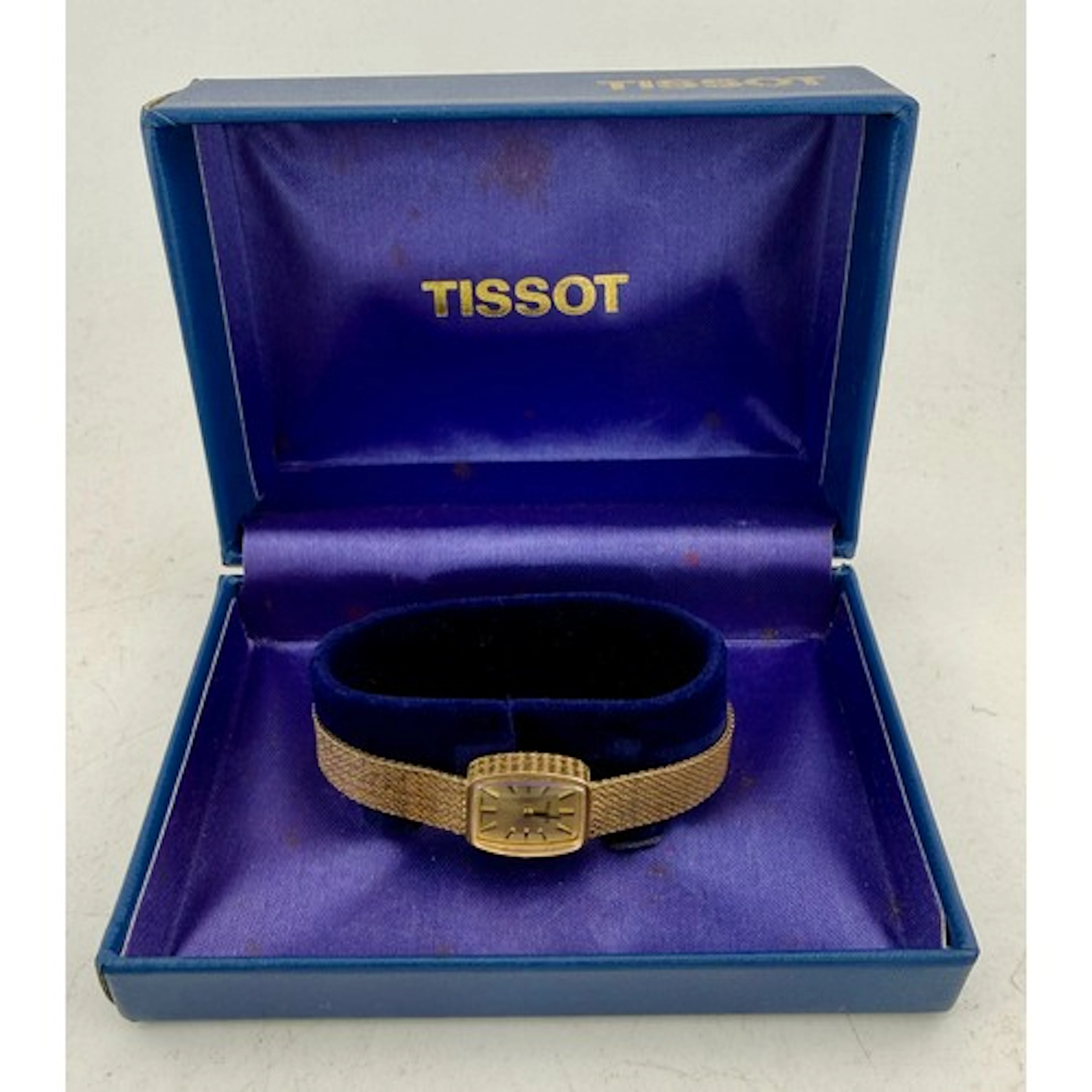 A nine carat gold Tissot ladies wristwatch on 9 carat gold s...