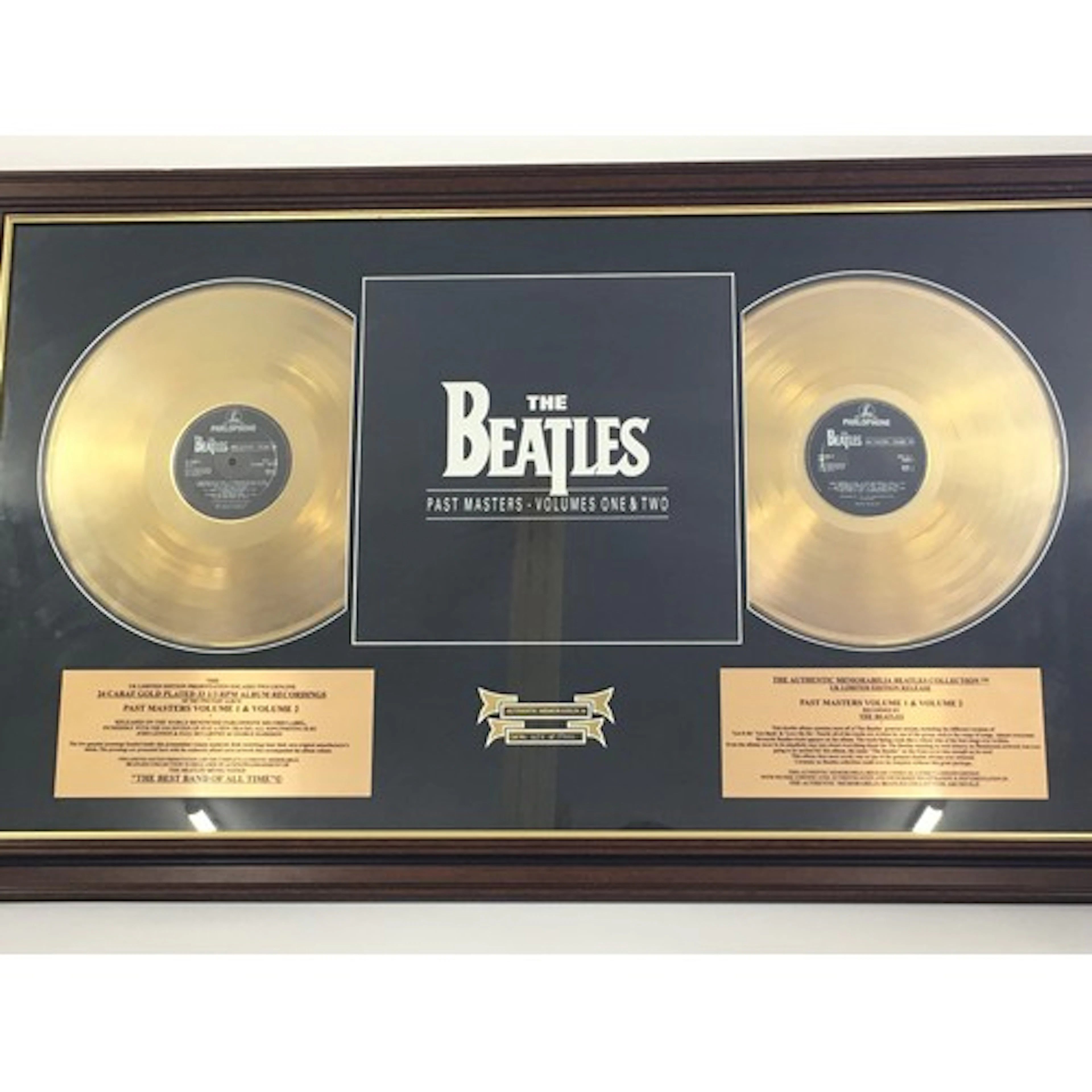 A framed and glazed limited edition Beatles double gold disc...