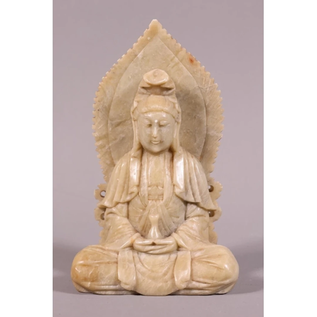 Carved soapstone figure of a seated monk, 14cm high.