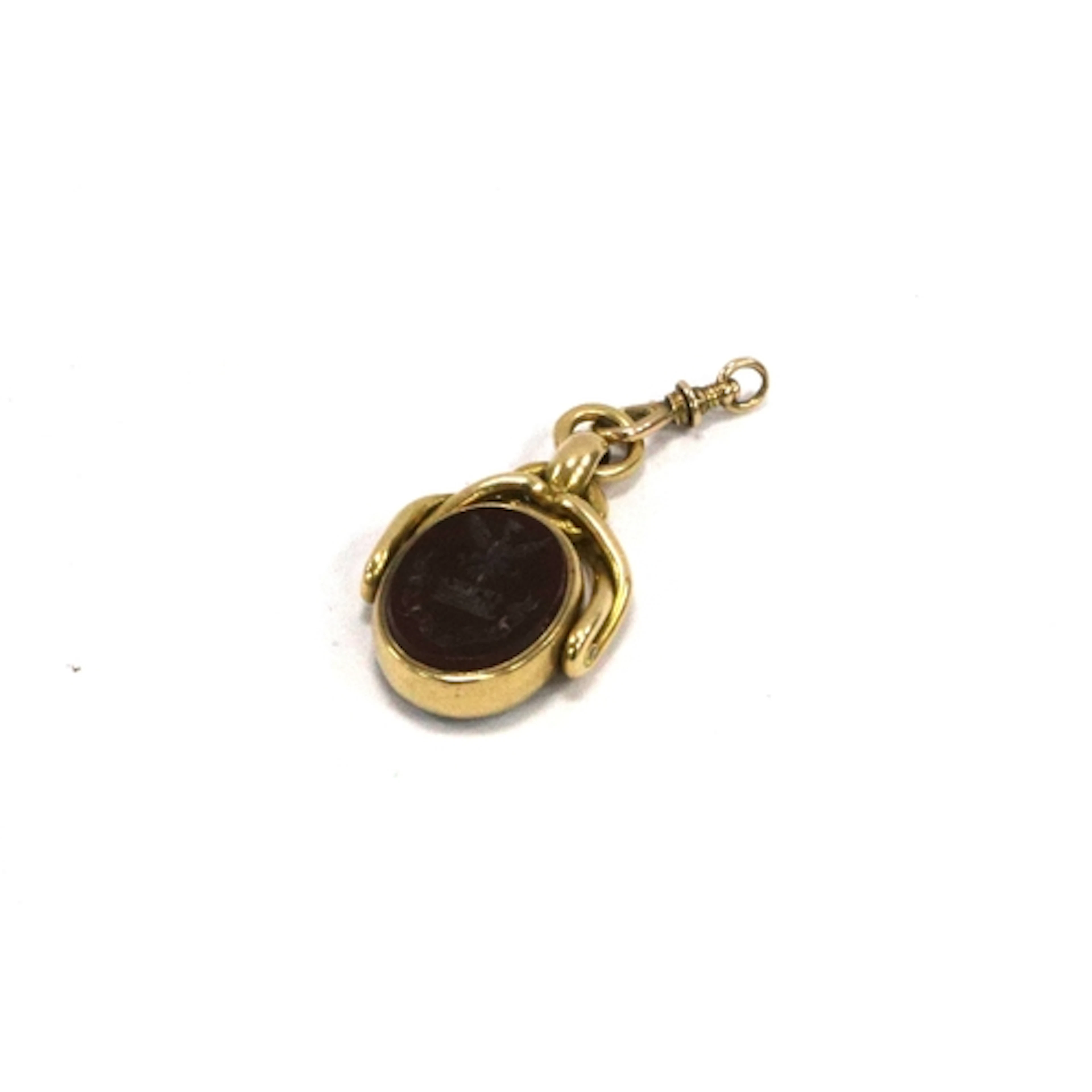 A Hallmarked 18ct Gold Swivel Fob Seal, the centre with carn...