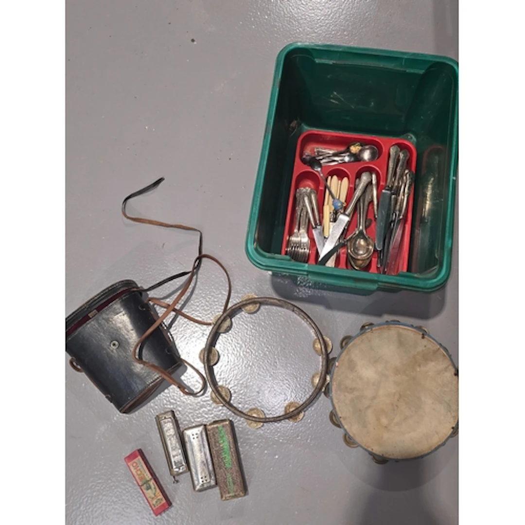 Mixed lot to include harmonicas, tambourines, binoculars and...