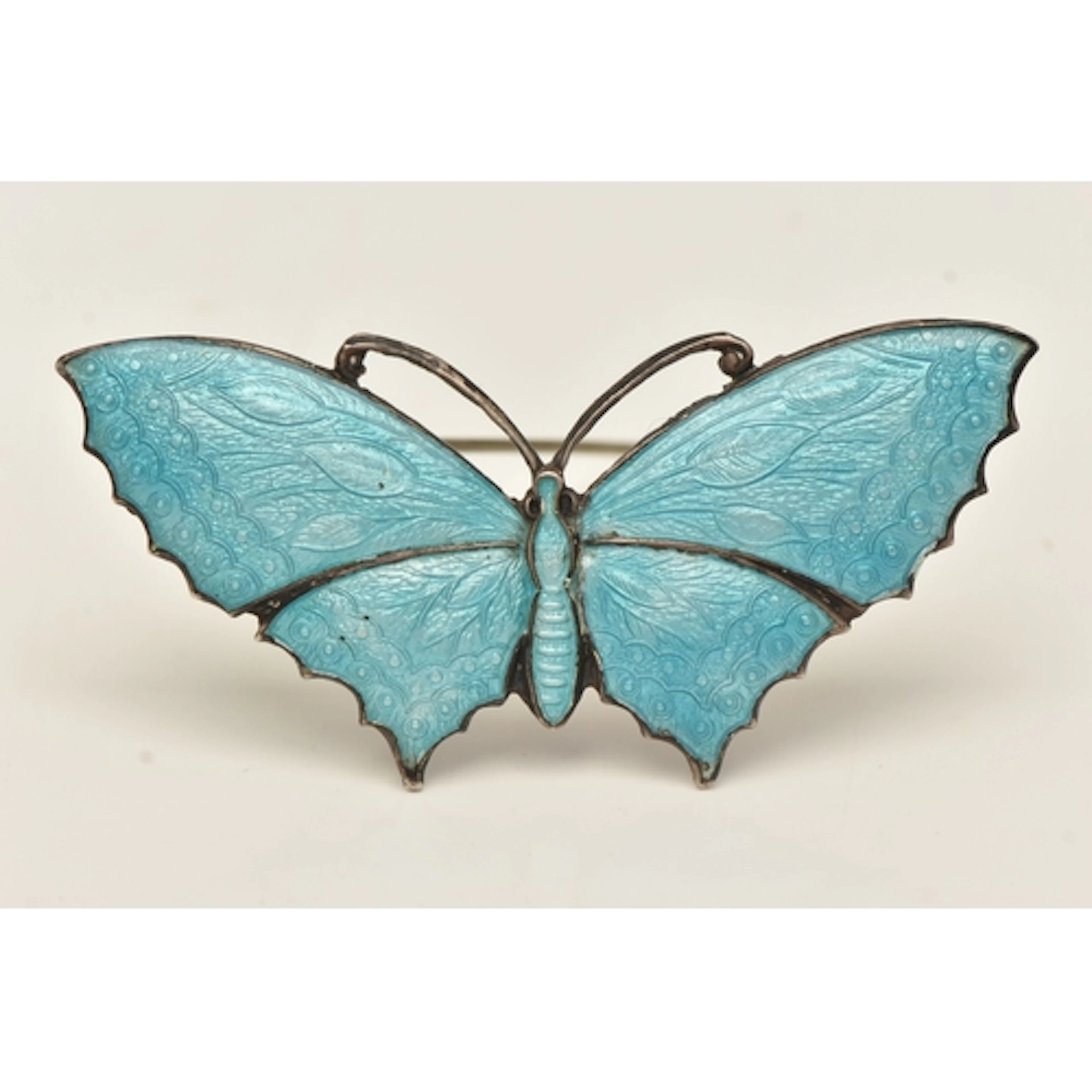 A WHITE METAL BLUE ENAMEL BUTTERFLY BROOCH, stamped 'Sterlin...