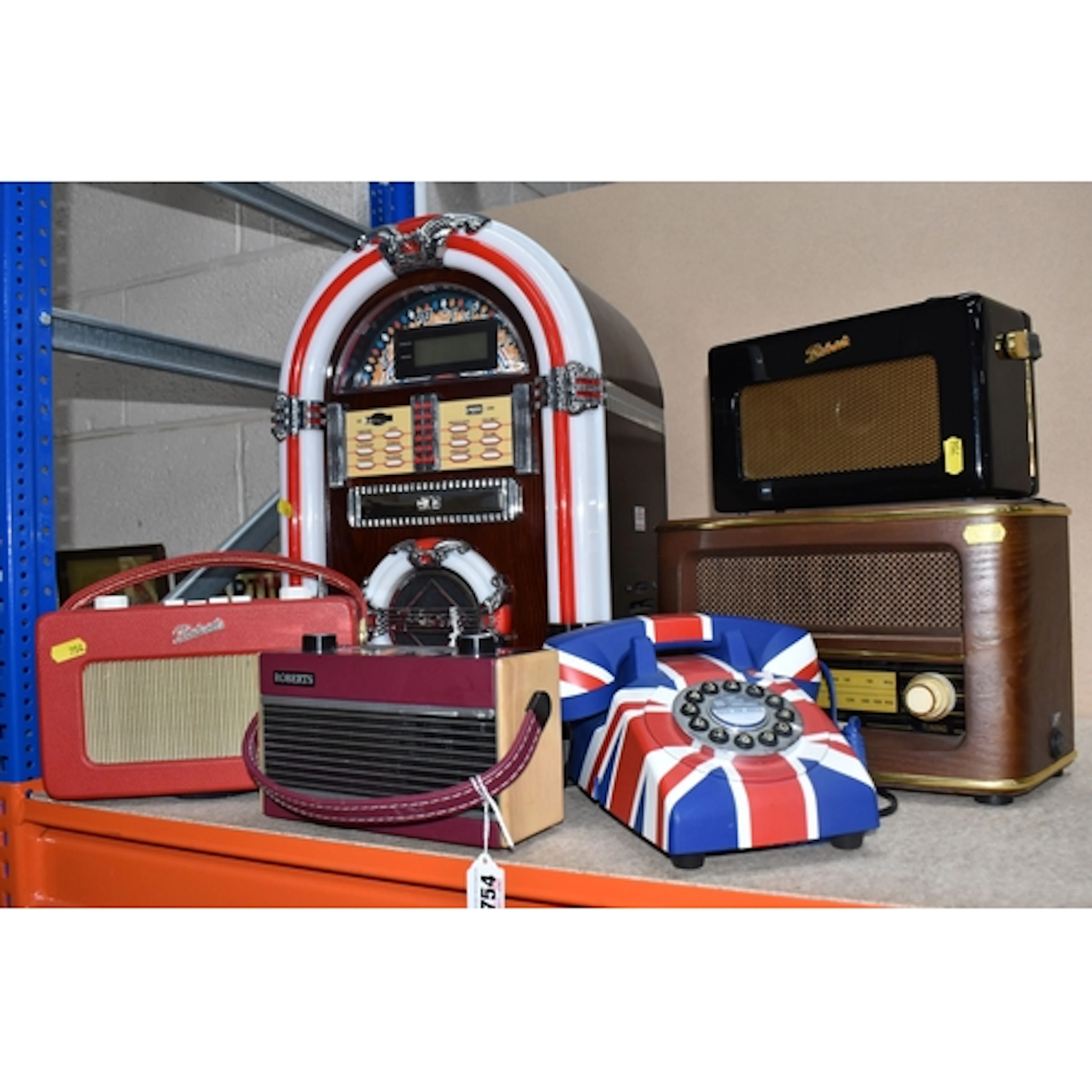 A GROUP OF REPRODUCTION VINTAGE RADIOS AND A JUKEBOX compris...