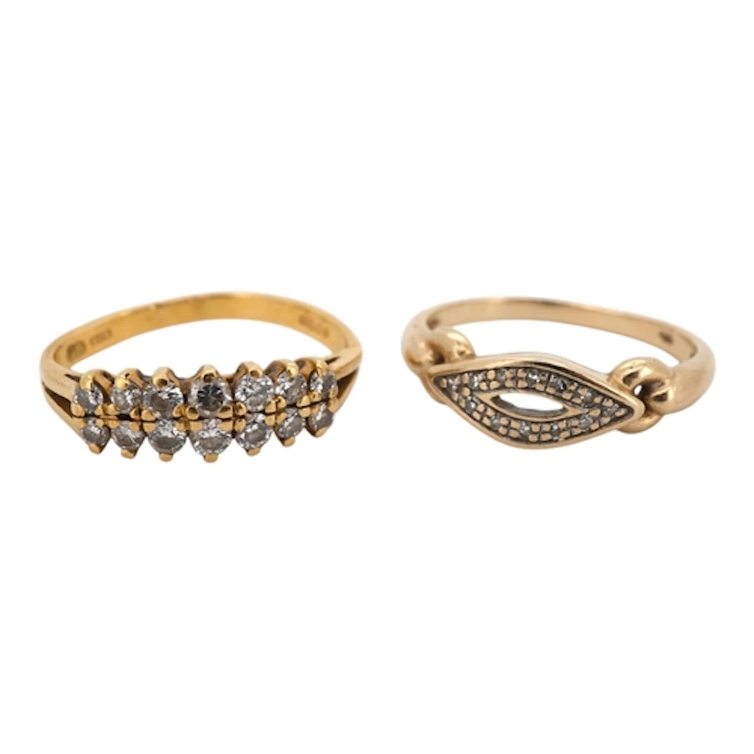 Two gold and diamond rings, comprising: a ring set with two ...