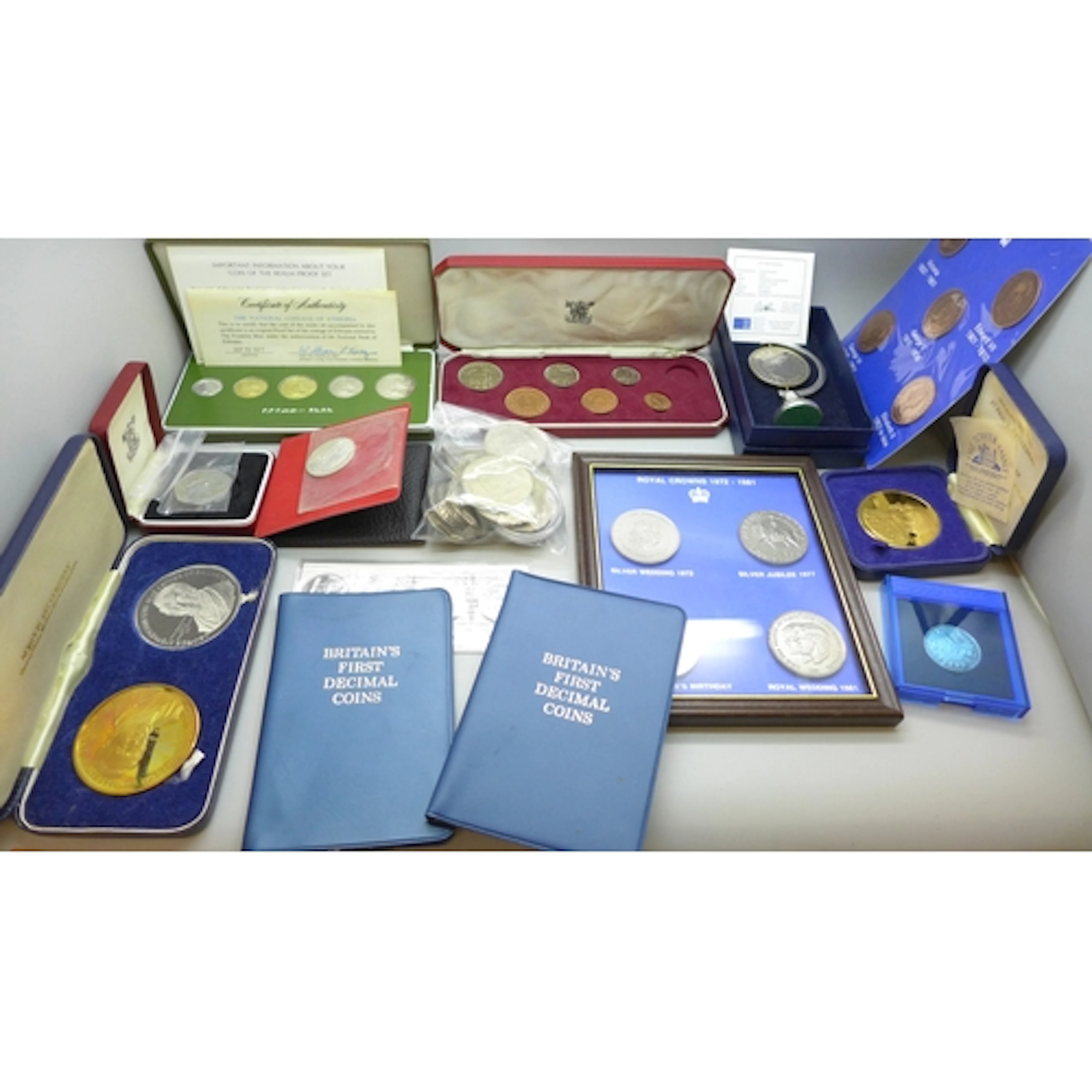 A collection of assorted coin sets including the National Co...