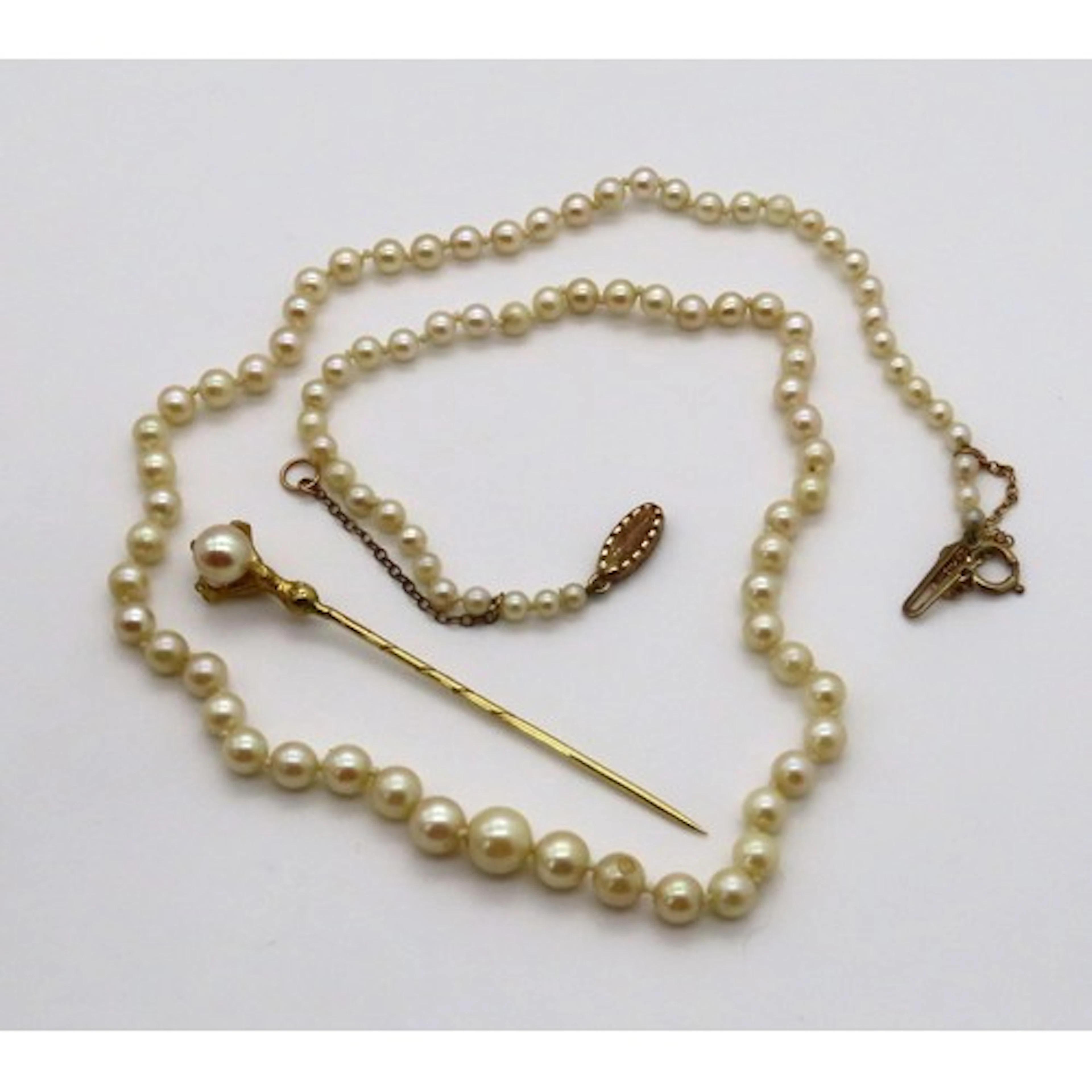A 9ct gold Eagle claw and pearl stick pin, 68mm in length, 2...