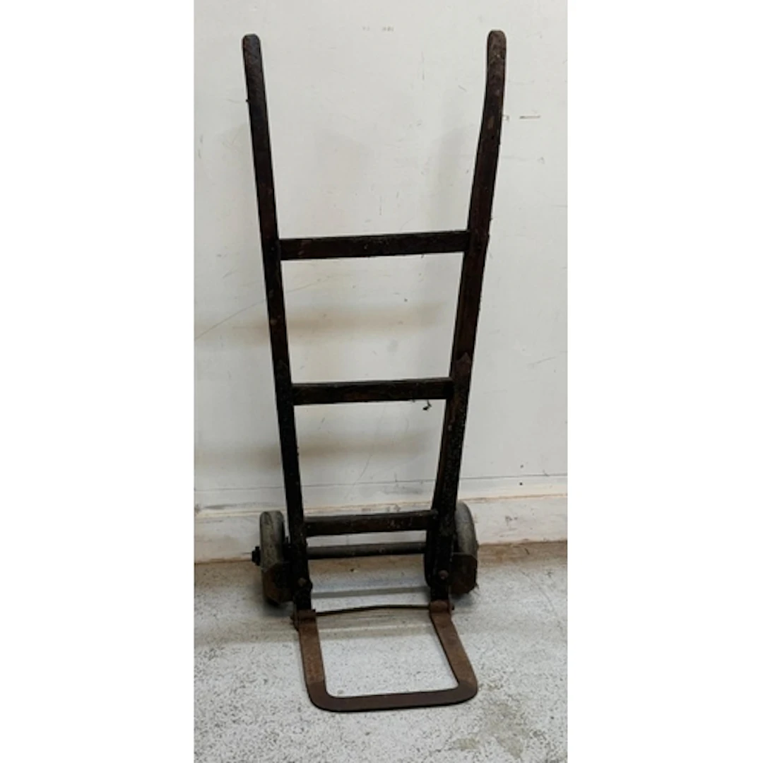 A vintage wooden and cast iron sack barrow