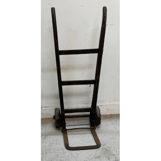 A vintage wooden and cast iron sack barrow