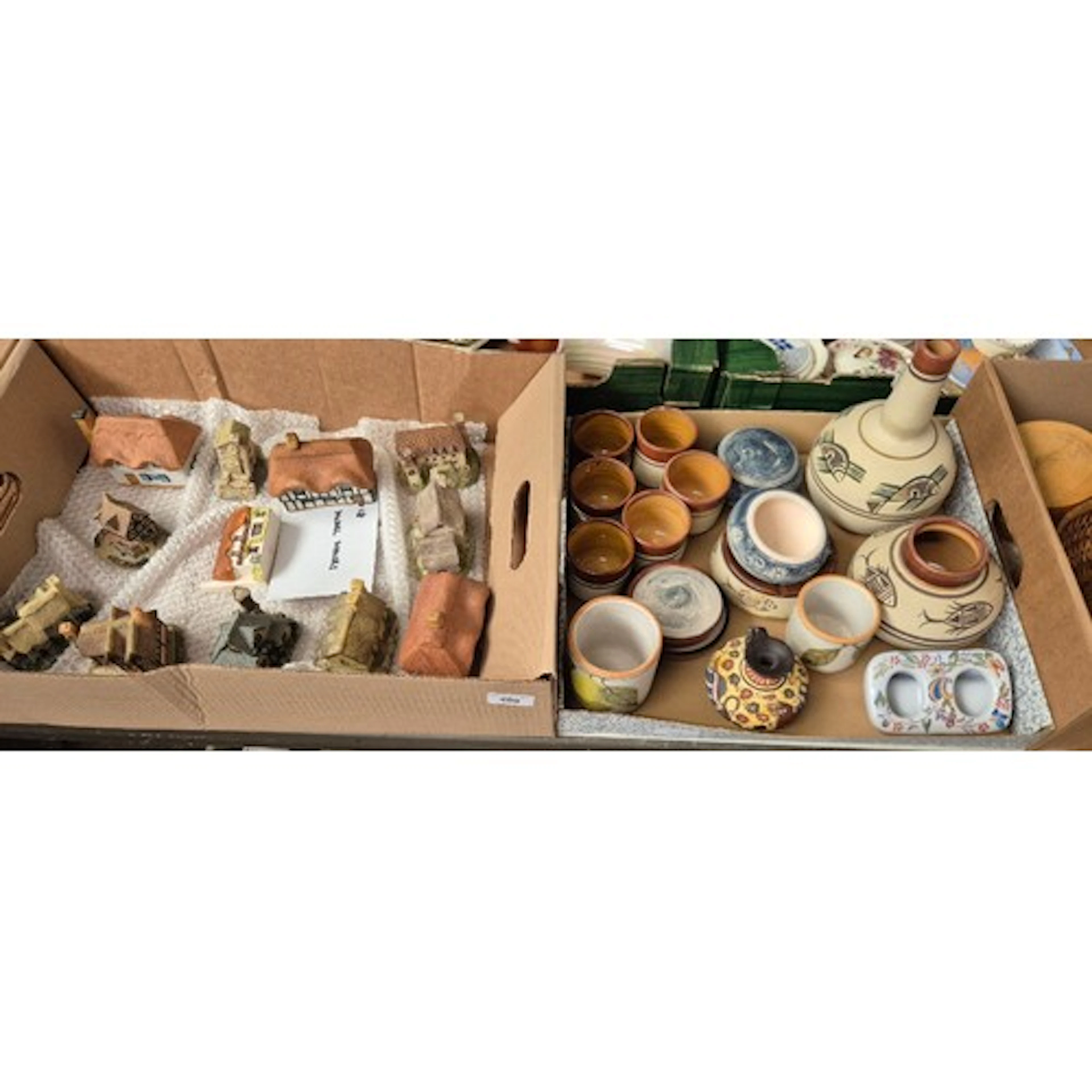 A box of studio pottery and a box of ceramic cottages etc