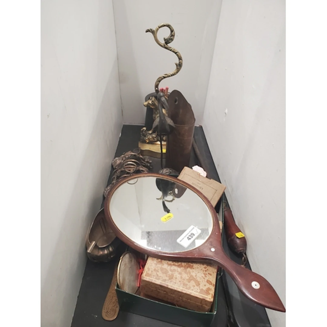 An antique brass Doorstop in the form of a seated dog, a Tan...
