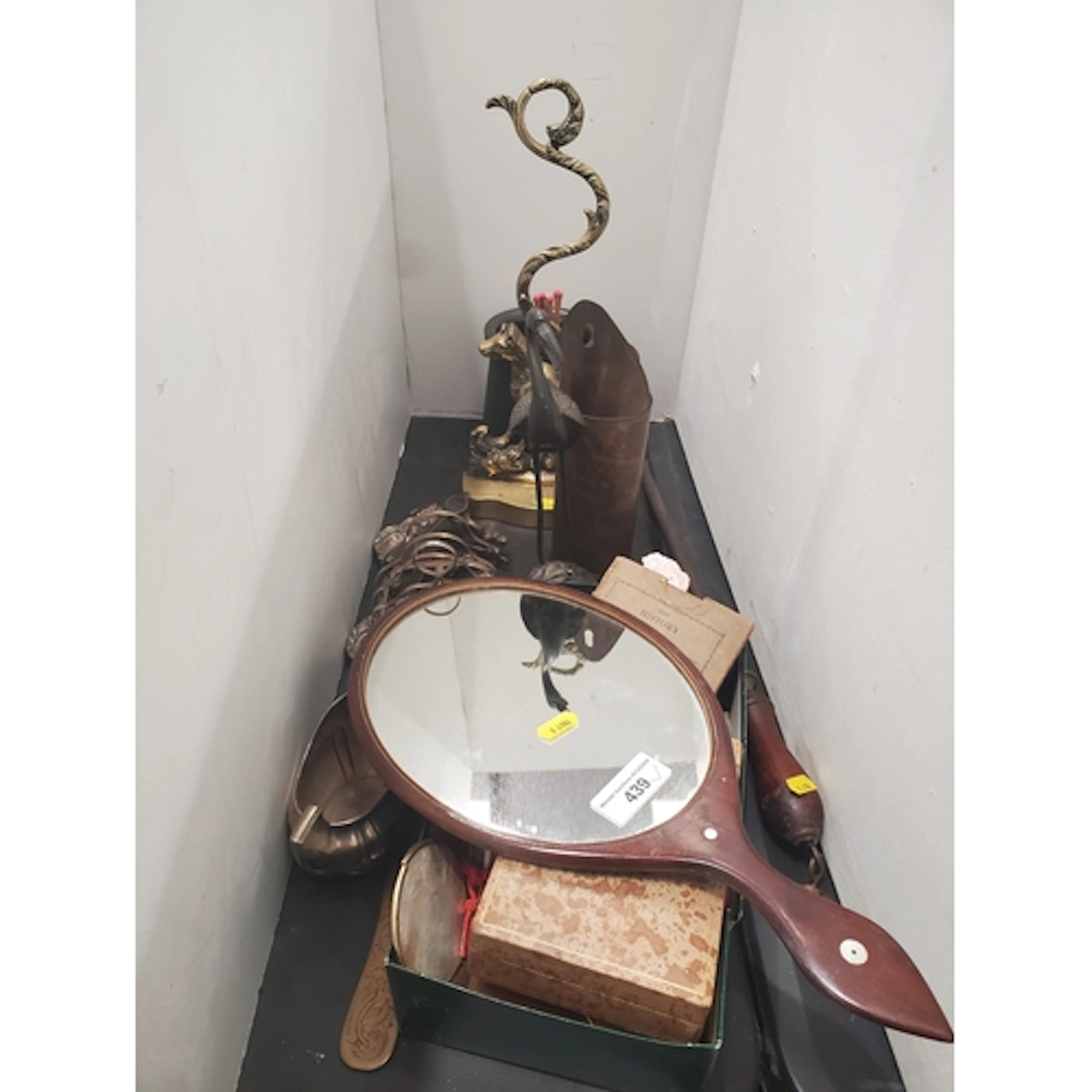 An antique brass Doorstop in the form of a seated dog, a Tan...