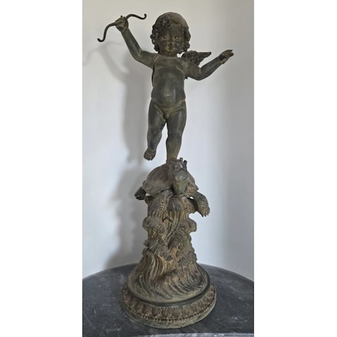 A pair of Cast Metal Cherubs standing on Tortoises. H 88 cm ...