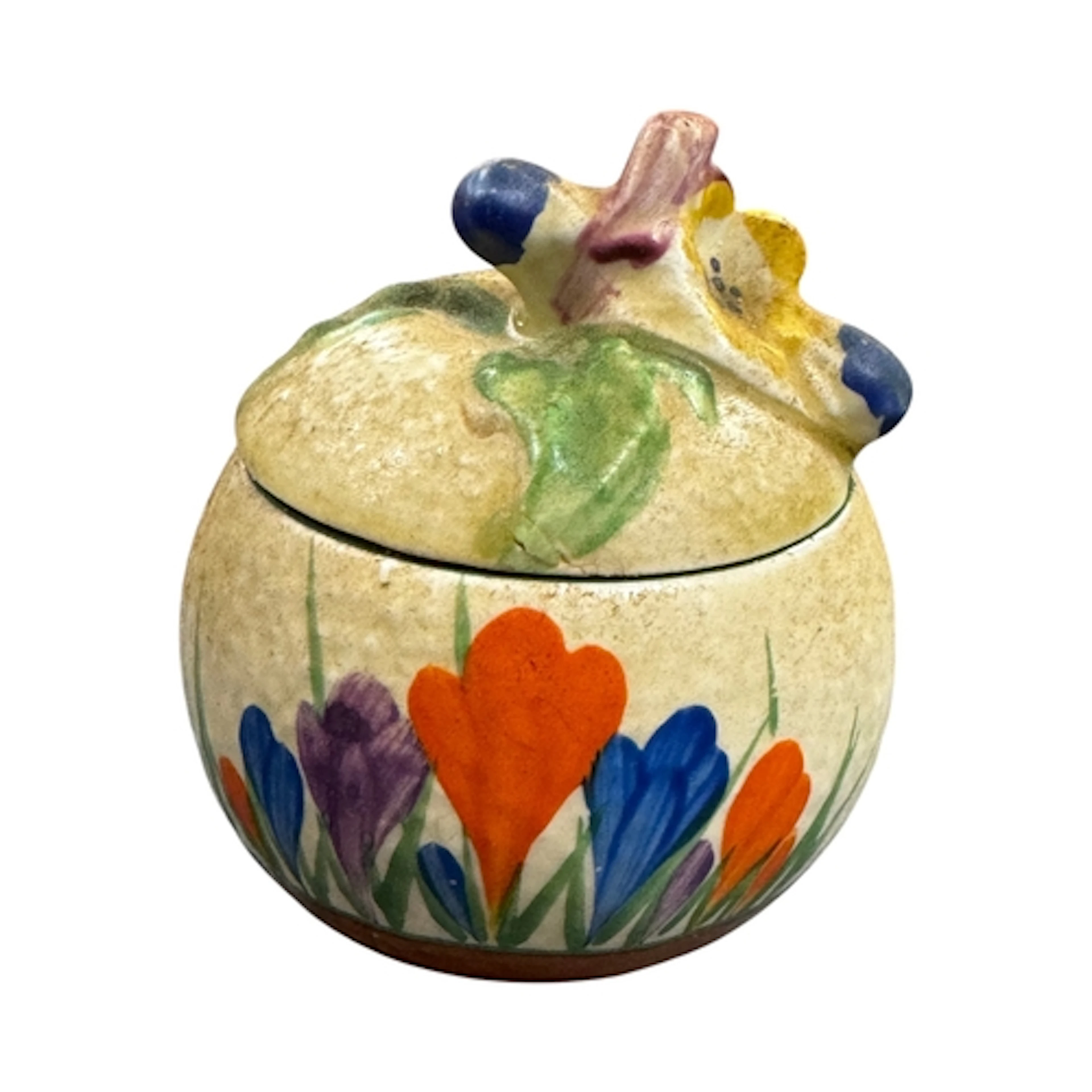 A Clarice Cliff Crocus pattern sugar pot and cover, 8cm high...