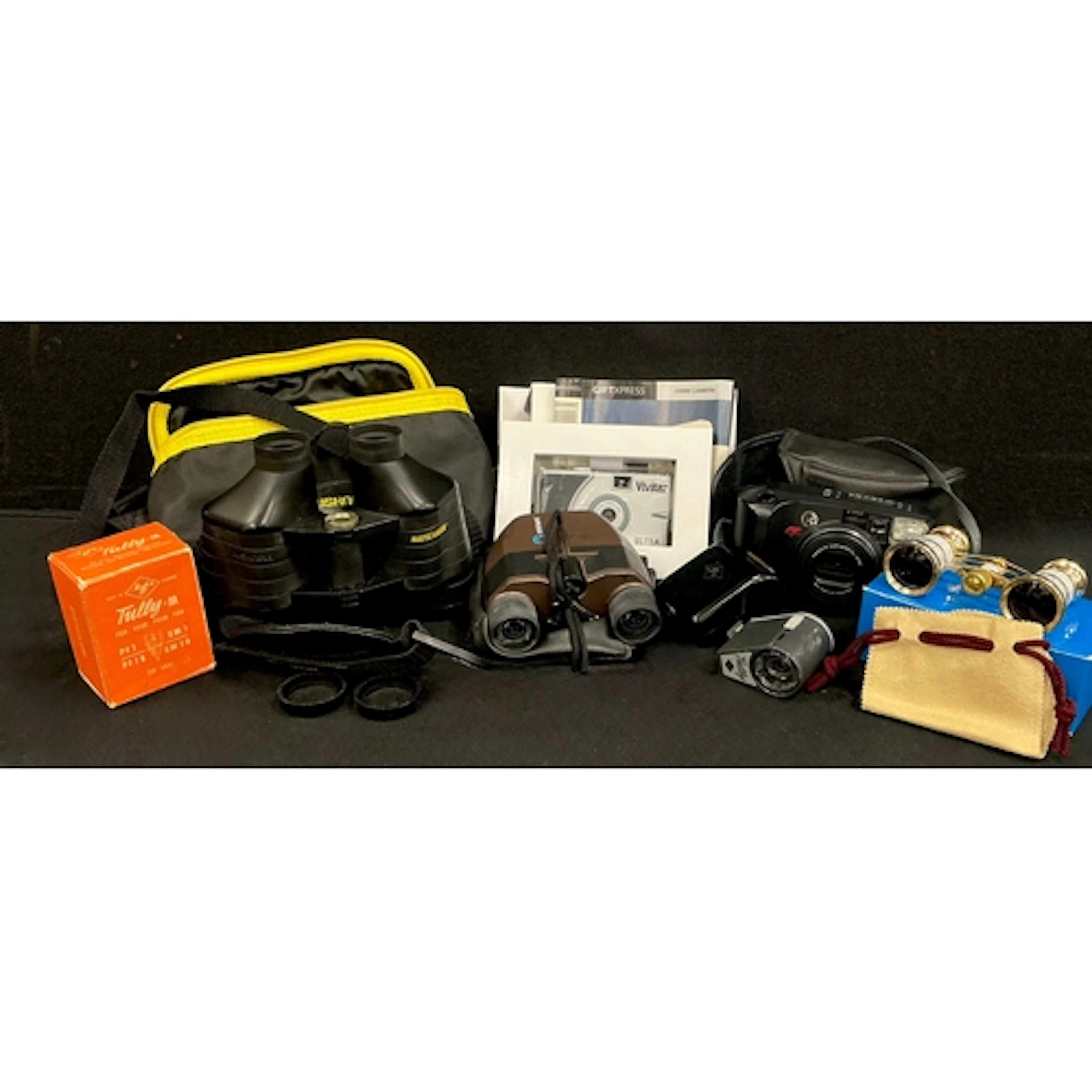 A vivitar 35mm slim design camera with box; a bushnell insta...