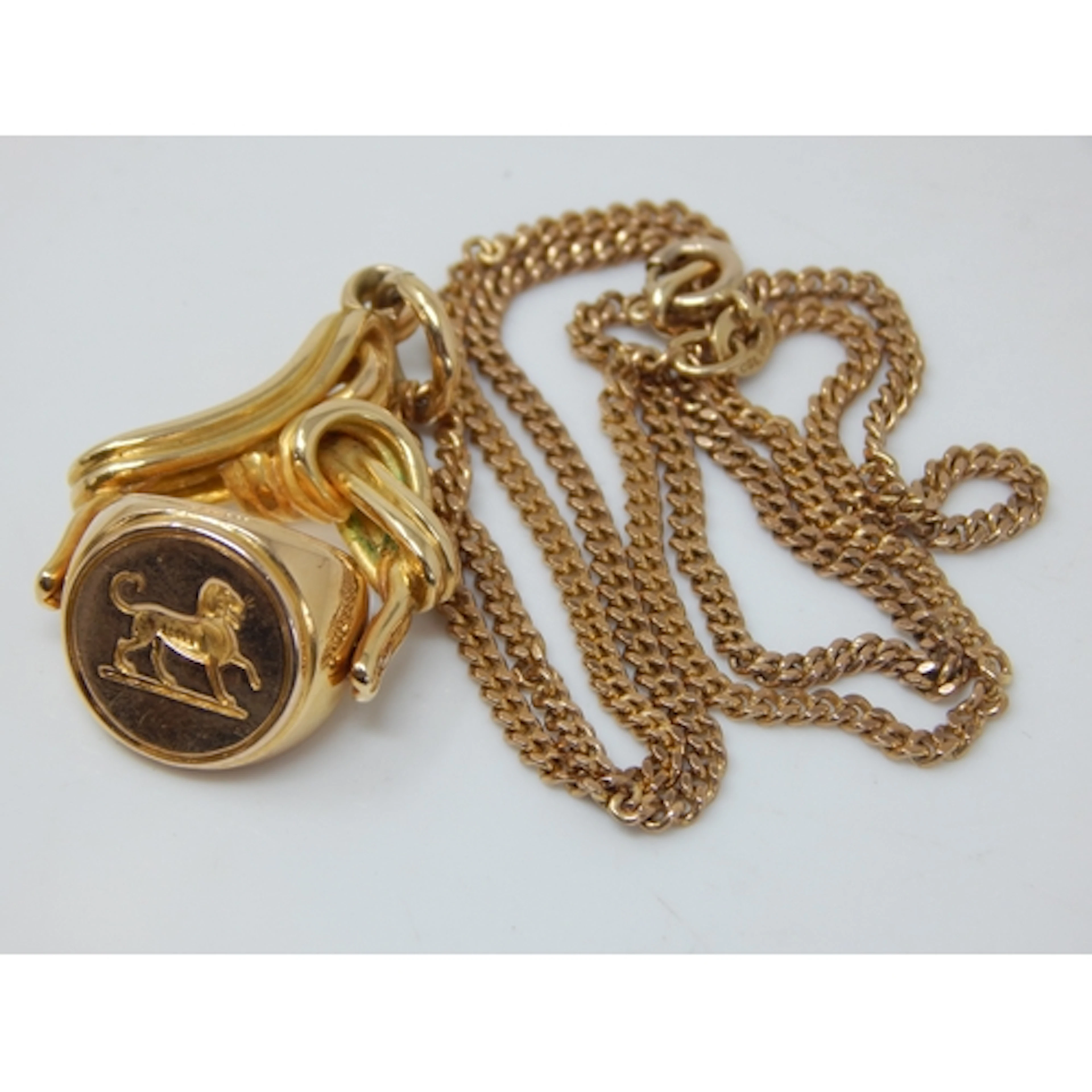 Unmarked Gold Swivel Fob Engraved with a Lion on 9ct Gold Ch...