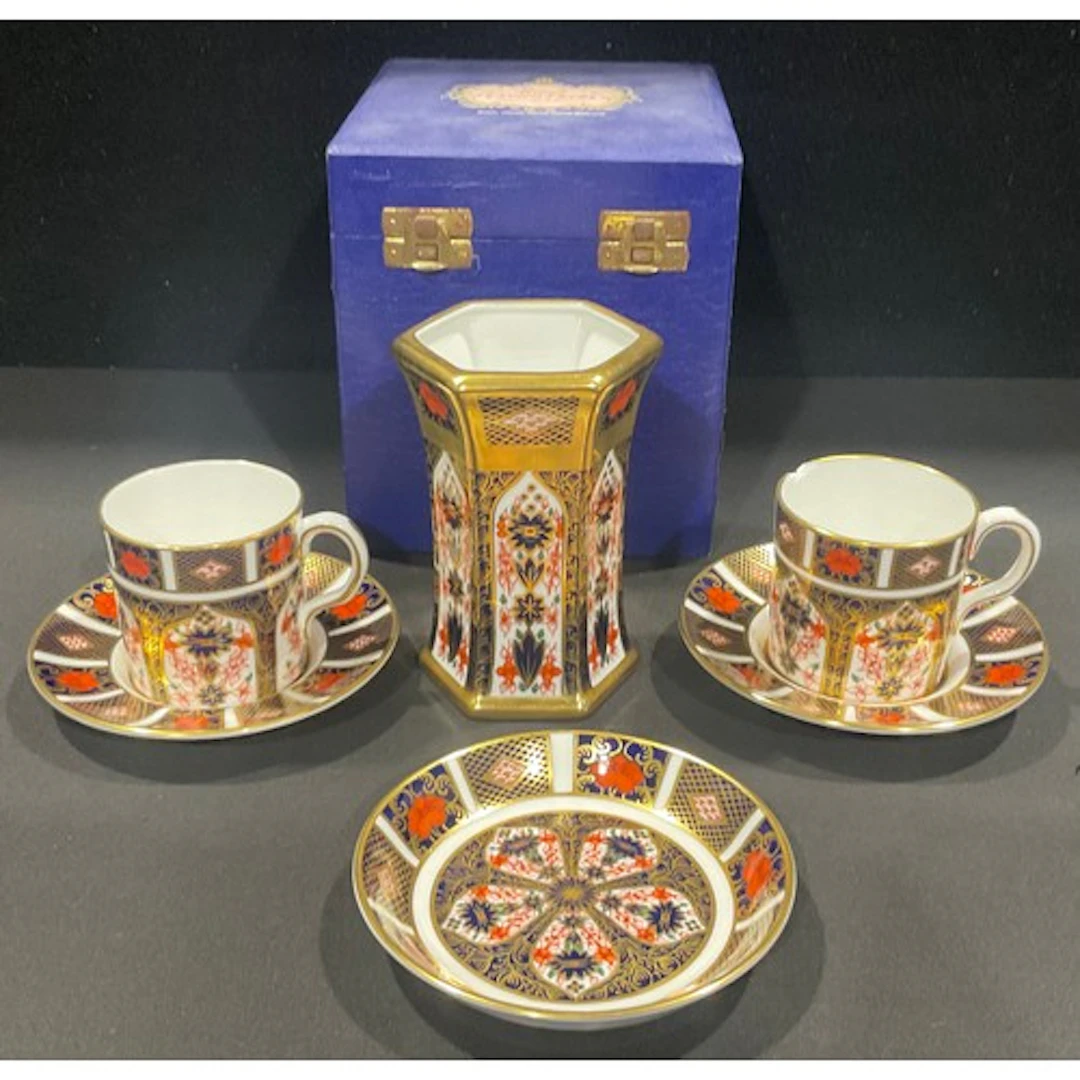 Royal Crown Derby - an 1128 Imari coffee can and two saucers...