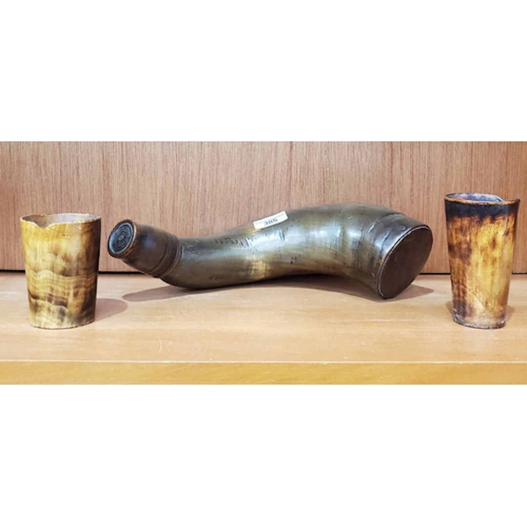 A large Drinking Horn and two horn Beakers