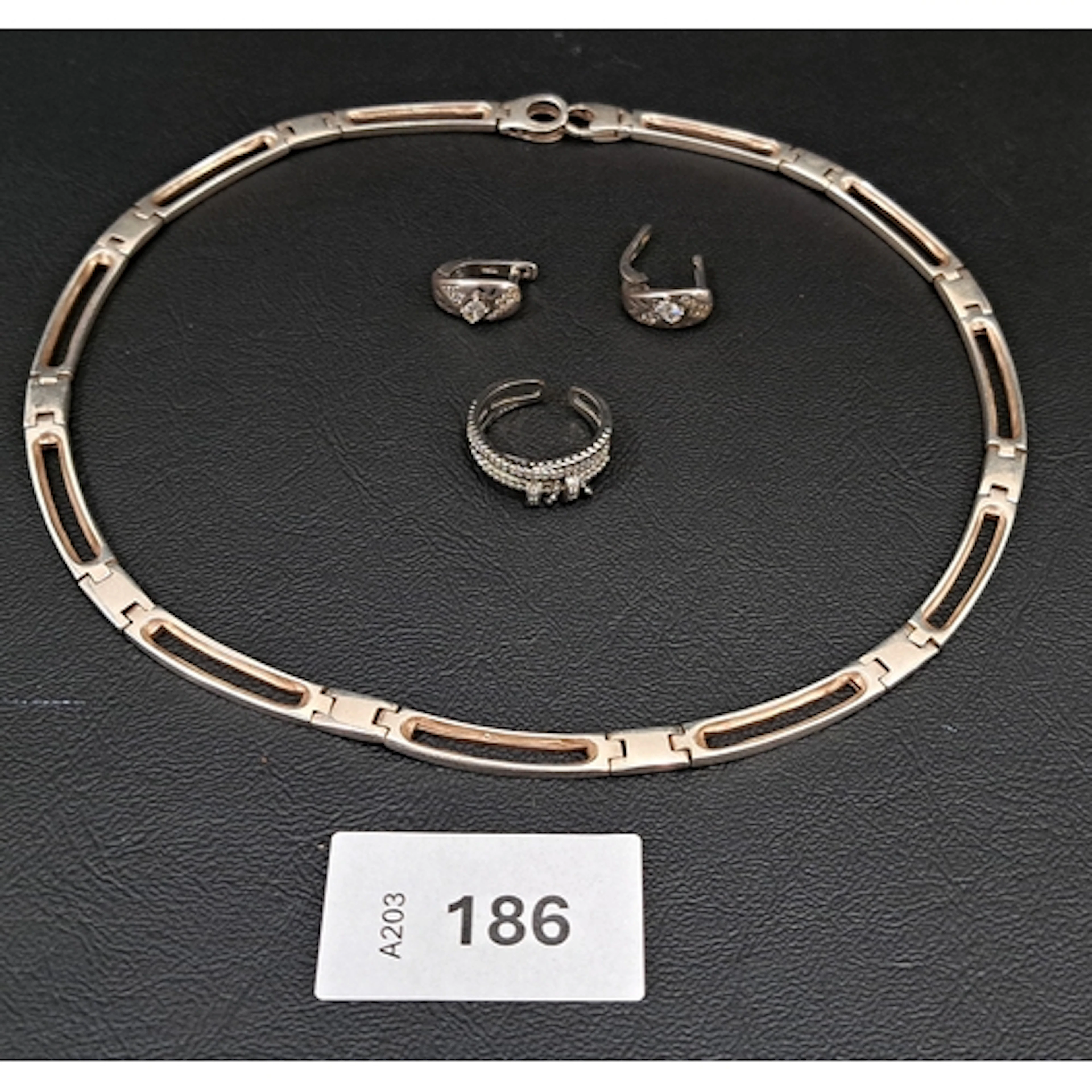 FOUR PIECES OF SILVER JEWELLERY comprising a pierced rectan...