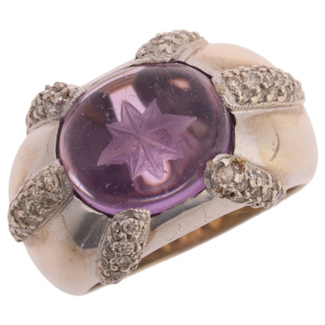 A 14ct white gold amethyst and diamond bombe ring, set with ...