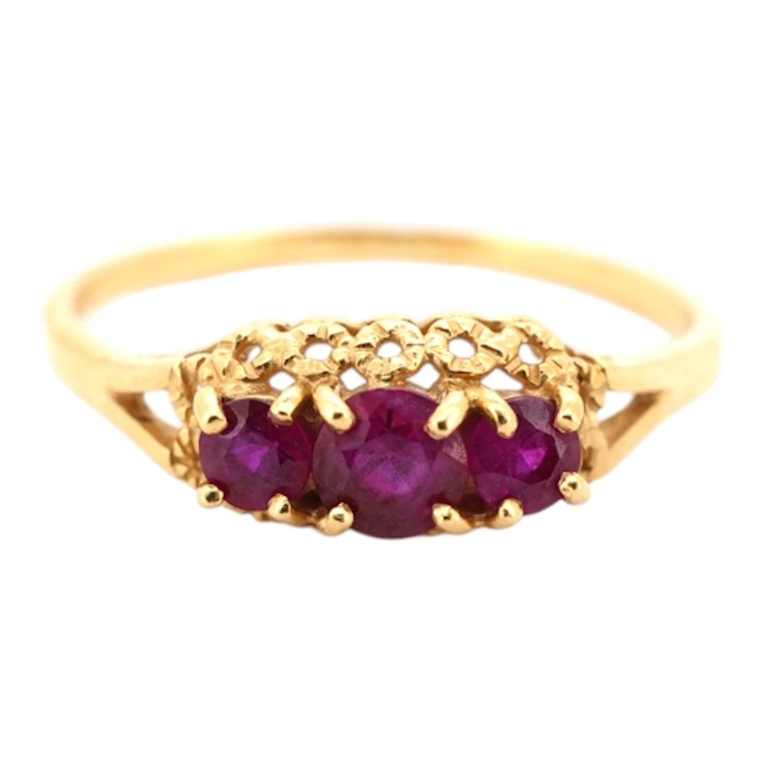 A ruby ring, claw-set with three circular-cut rubies totalli...