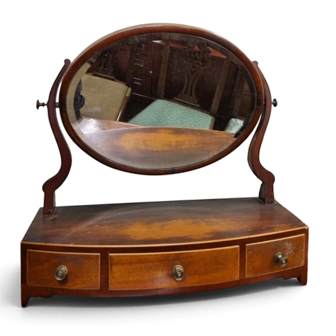 A Regency Mahogany bow fronted Crutch Mirror with triple fri...