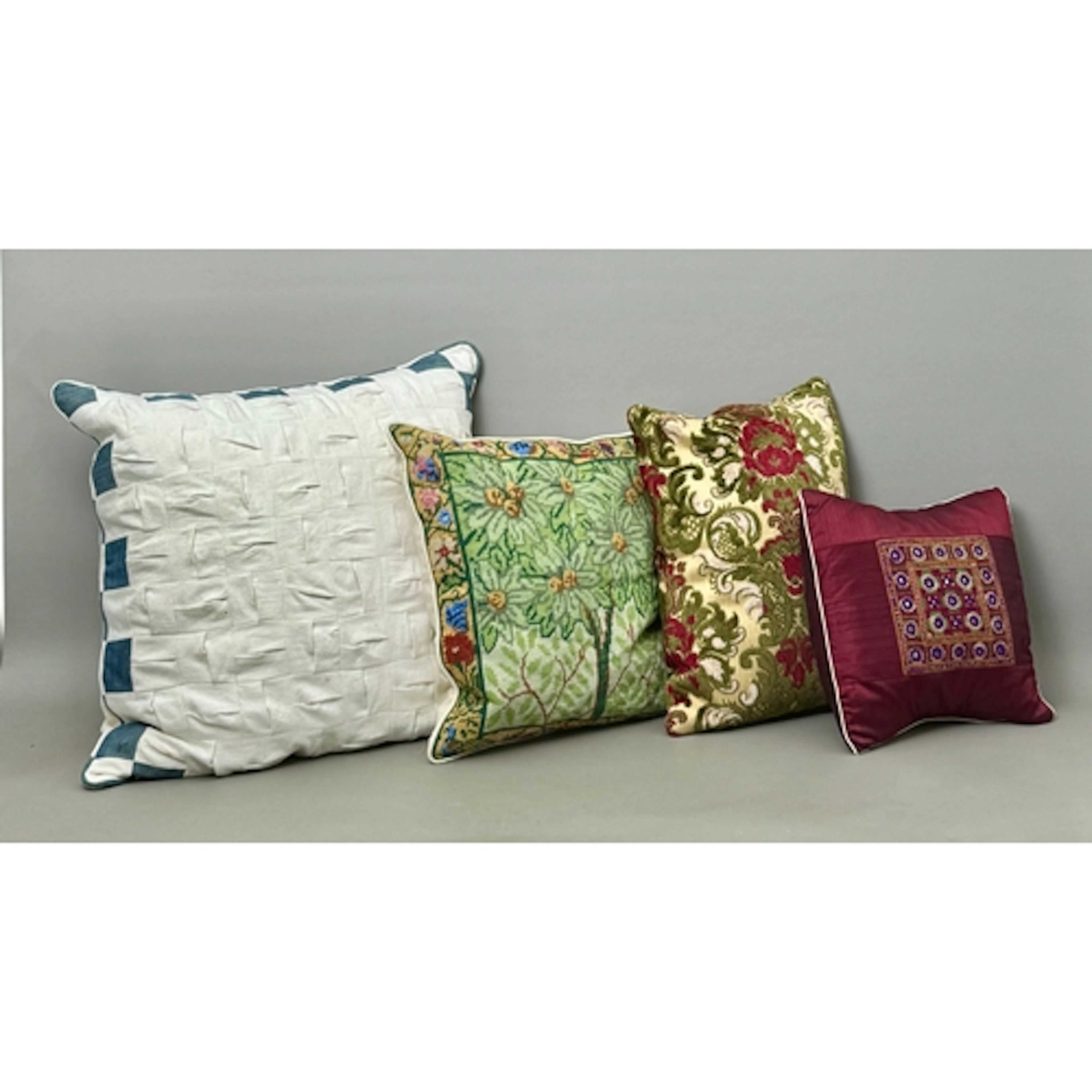 Four cushions - to include a needlepoint Ehrman tapestry cus...