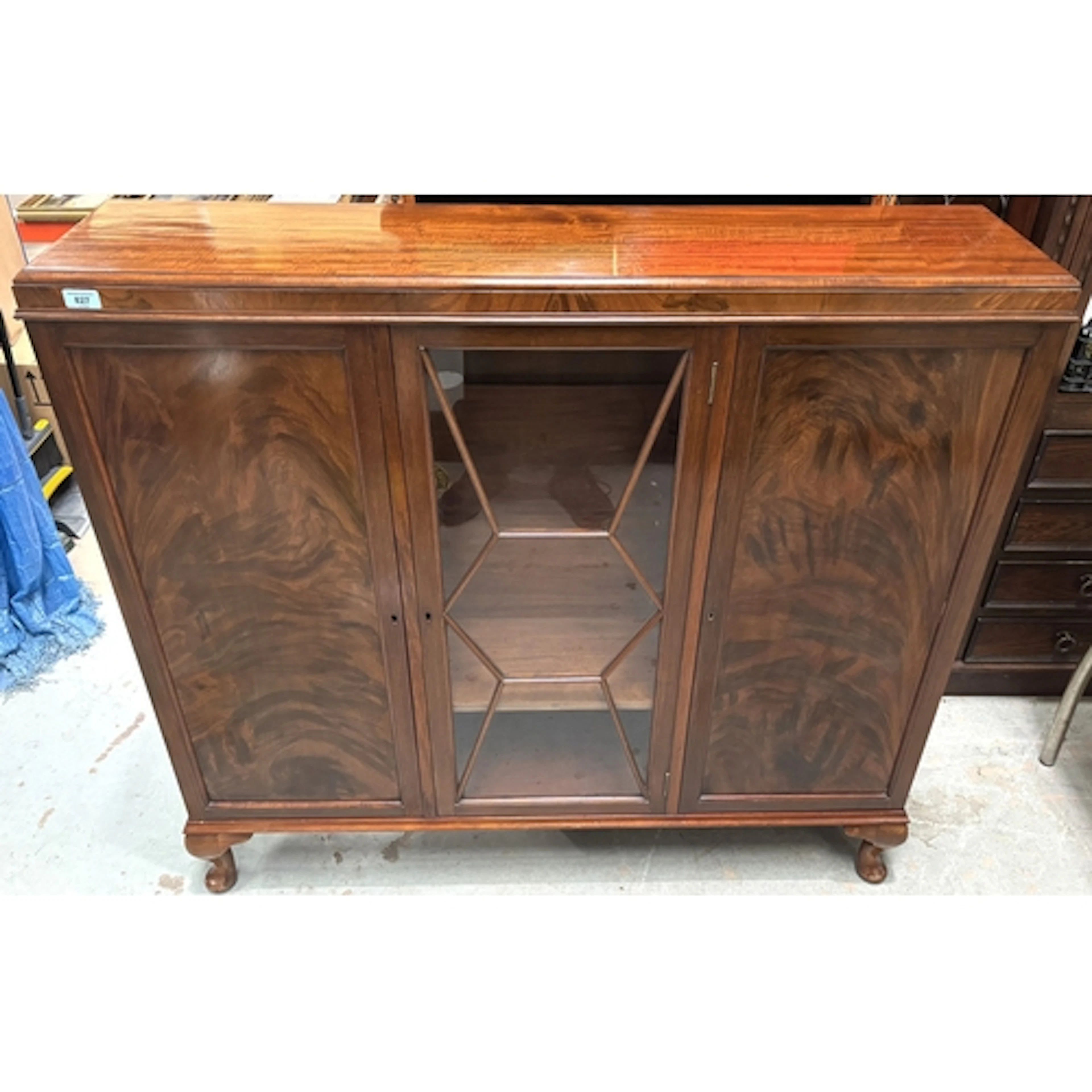 An early 20th century mahogany cabinet with central display ...