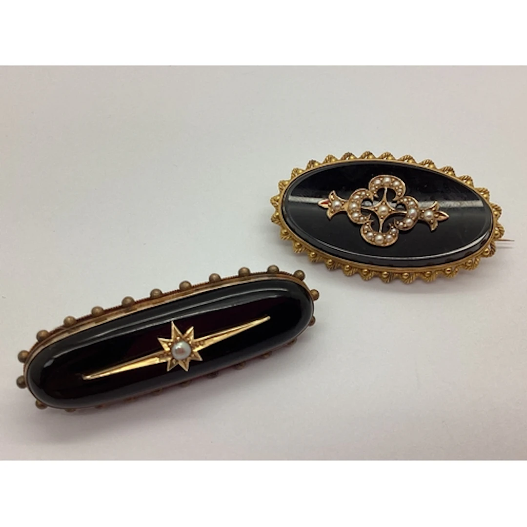 A Victorian Locket Back Mourning Brooch, of oval form with a...