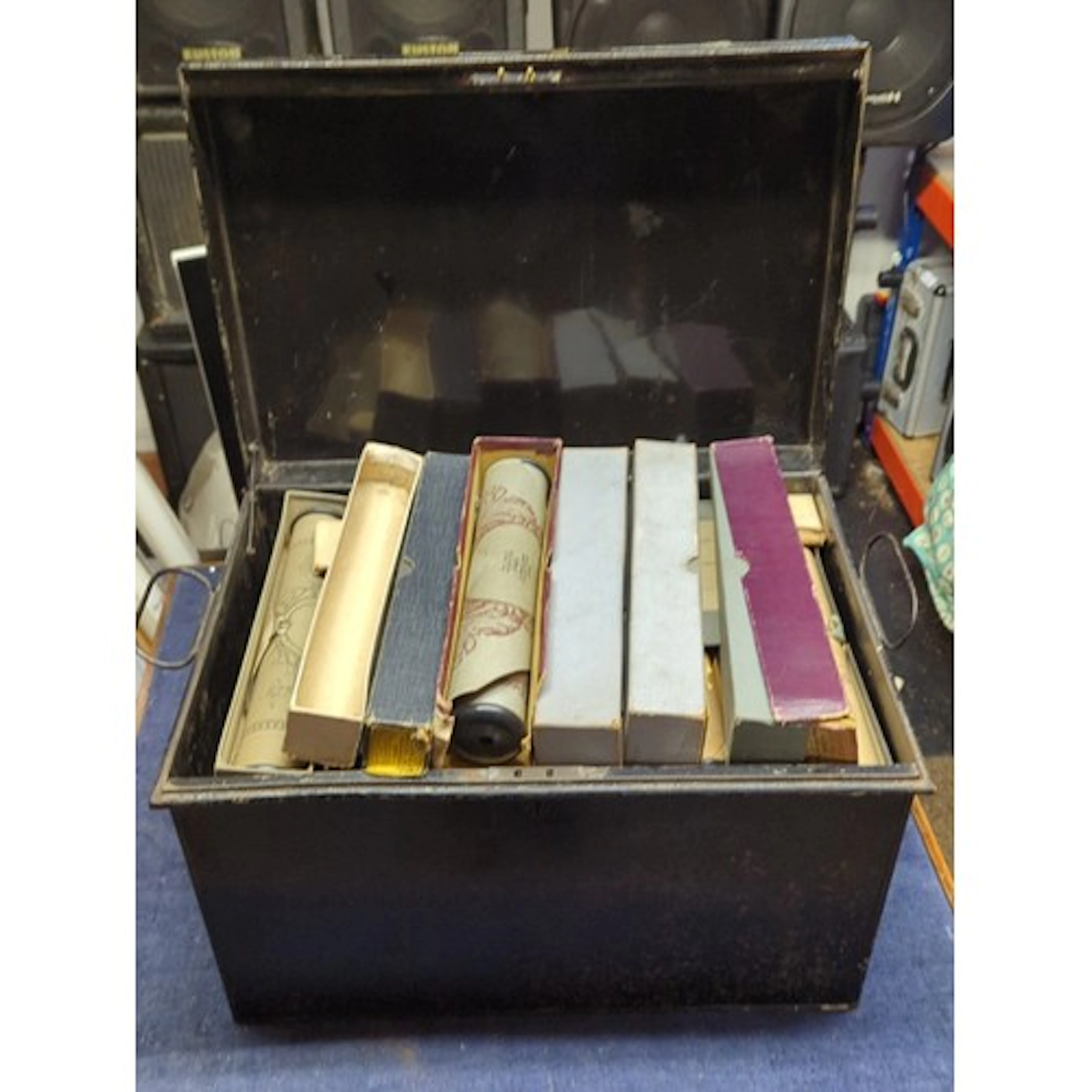 A group of early 20th-century player-piano music rolls, prin...