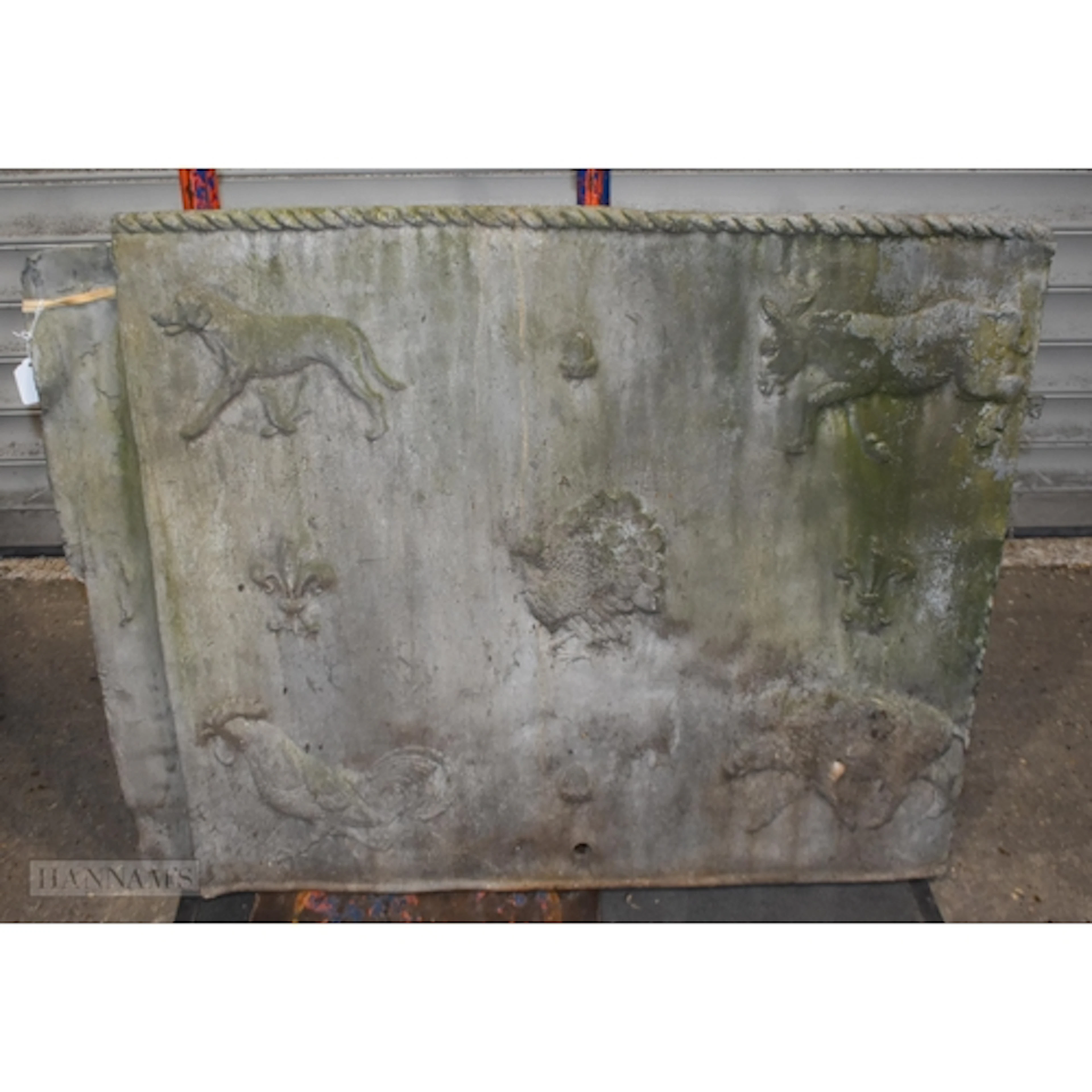 An antique heavy cast lead plaque decorated with animals 80 ...