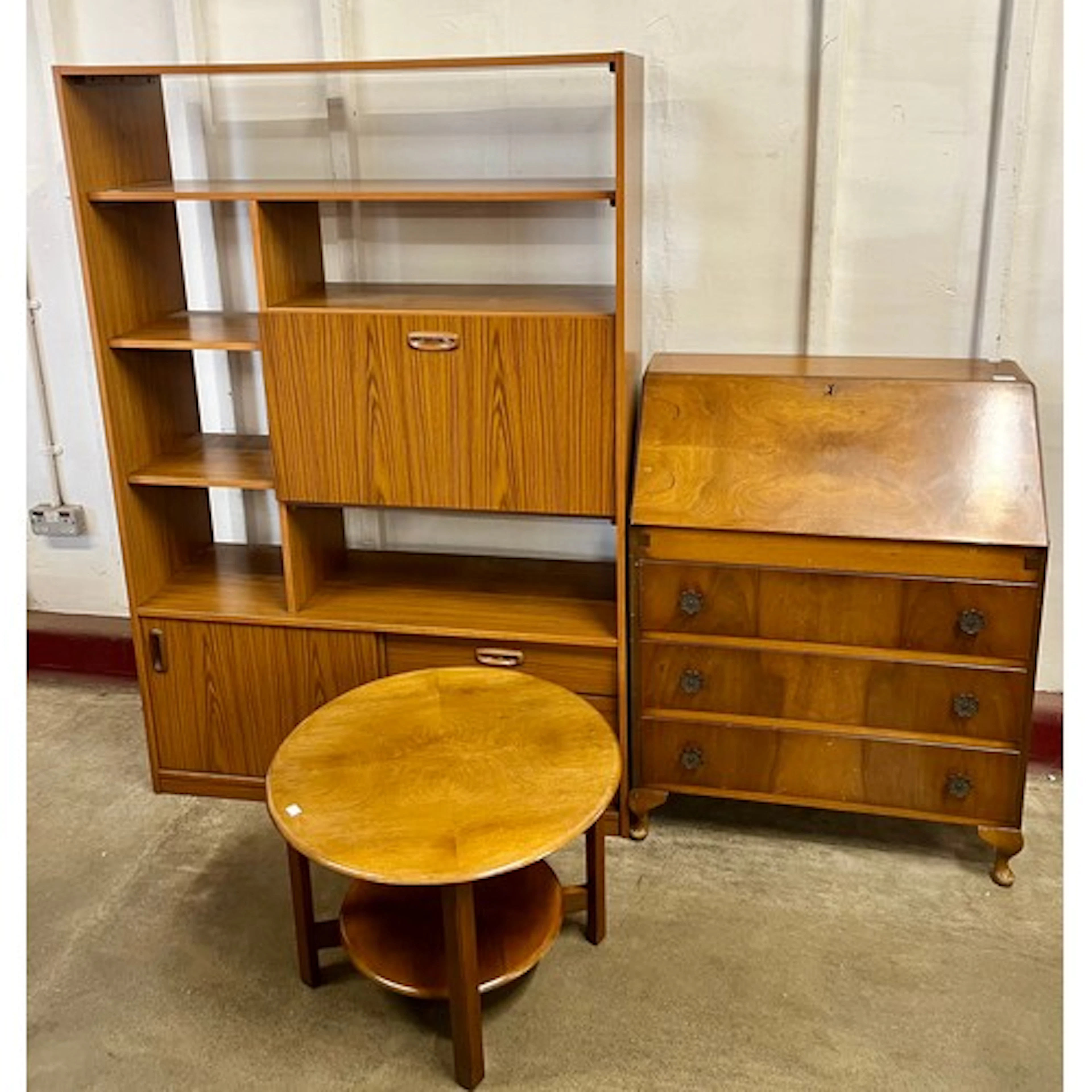 A simulated teak room divider, walnut bureau and a circular ...