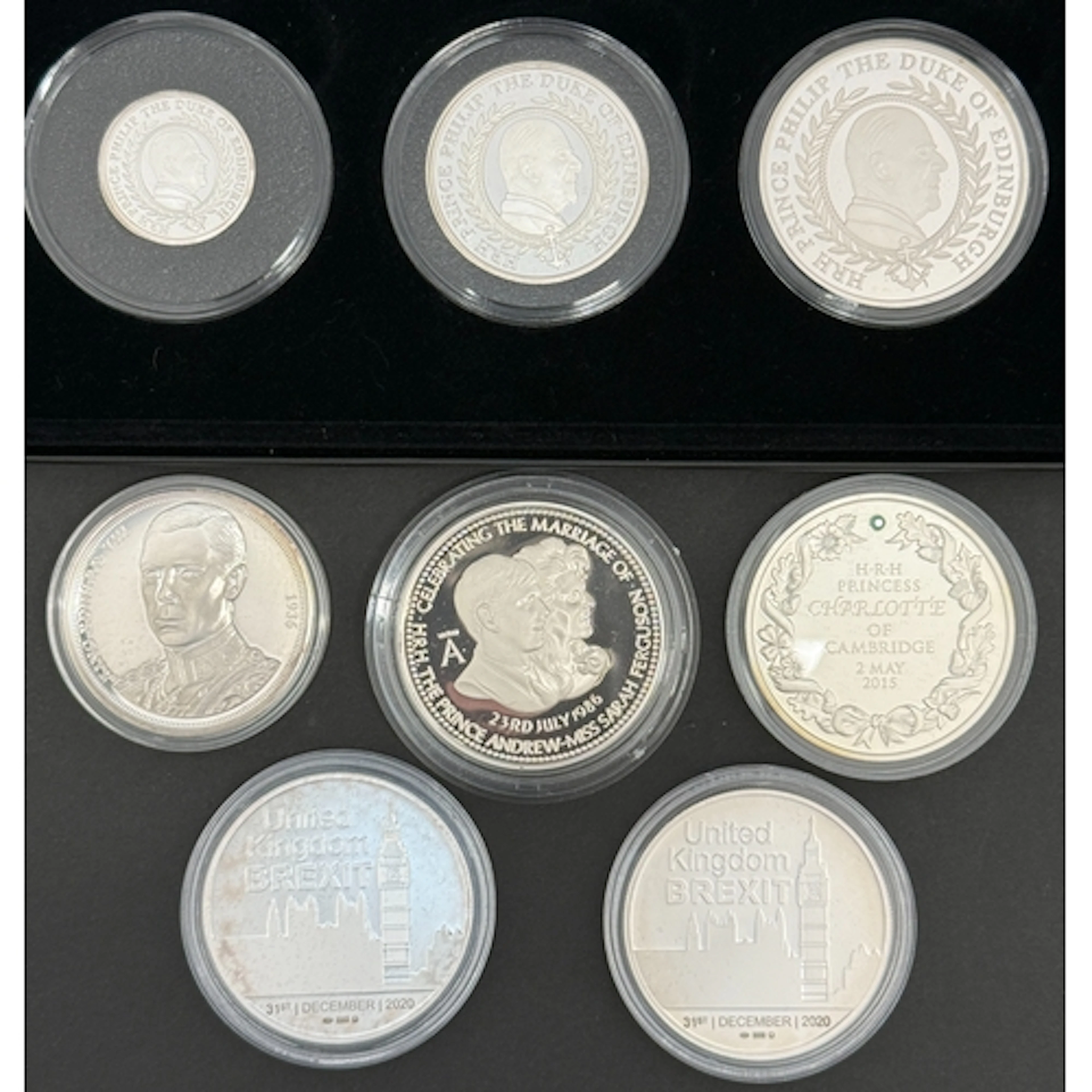 A group of modern commemorative silver coins and medals, com...