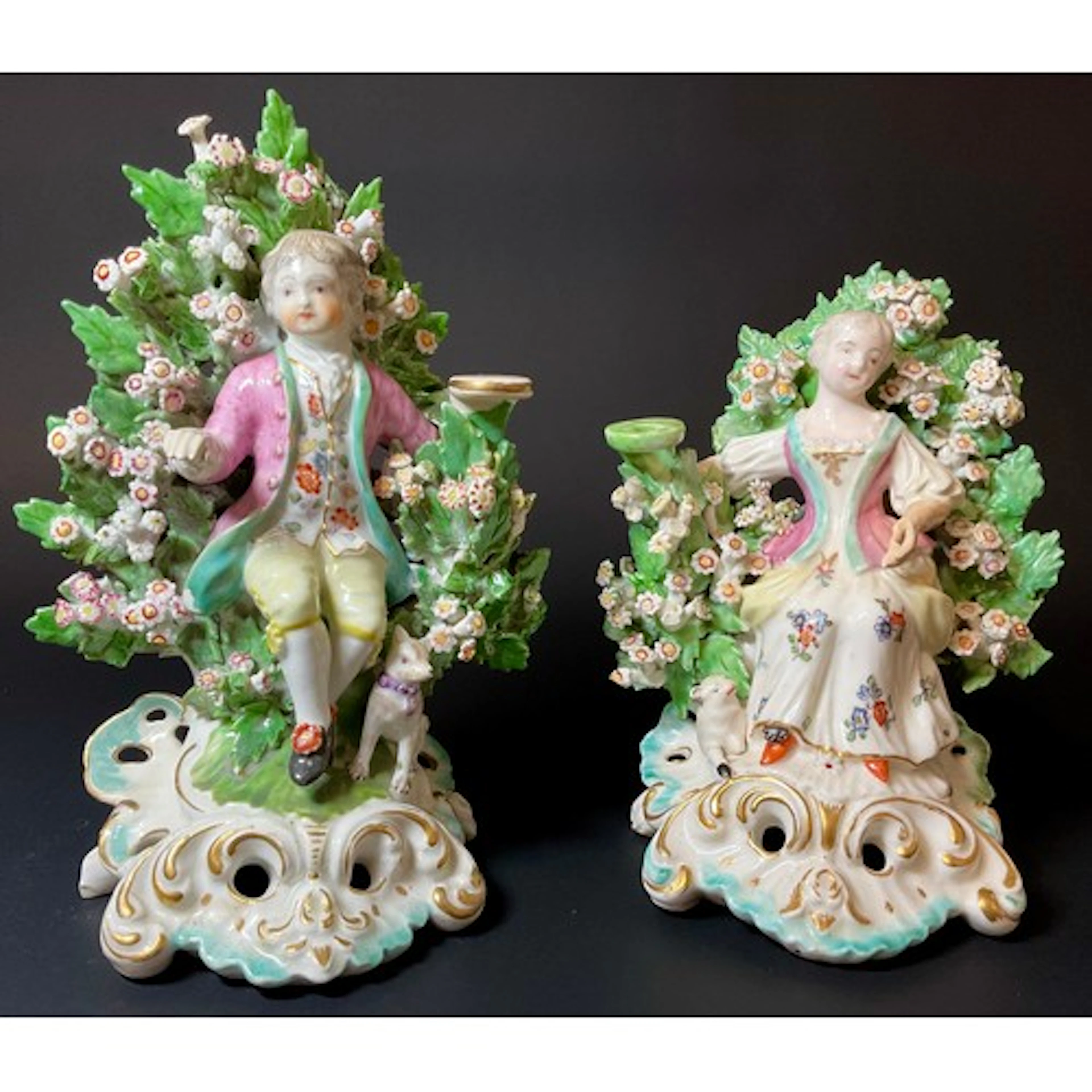 A near pair of Derby patch mark candlesticks, Spring, a boy ...