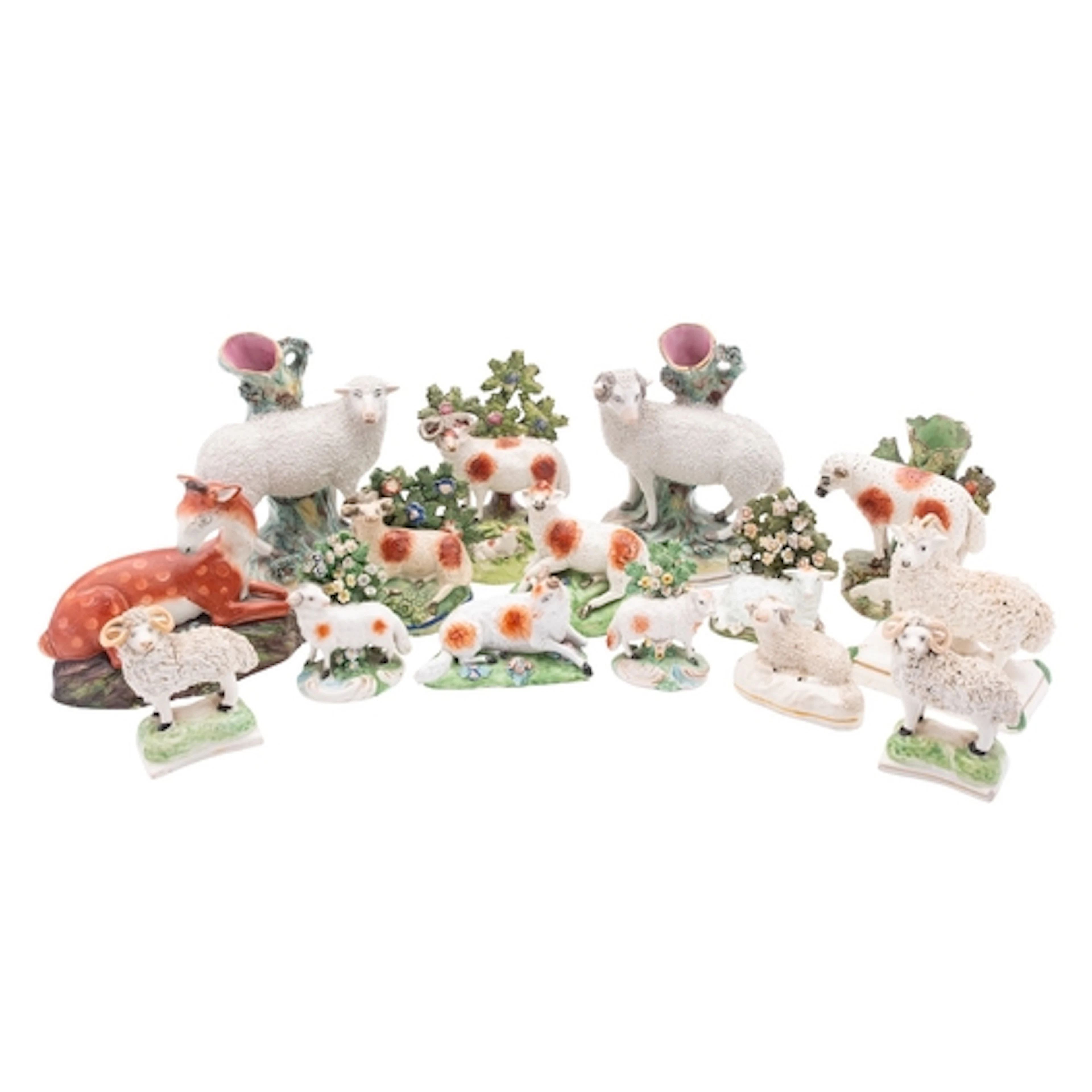 Fourteen pearl ware and porcelain sheep figures, comprising ...