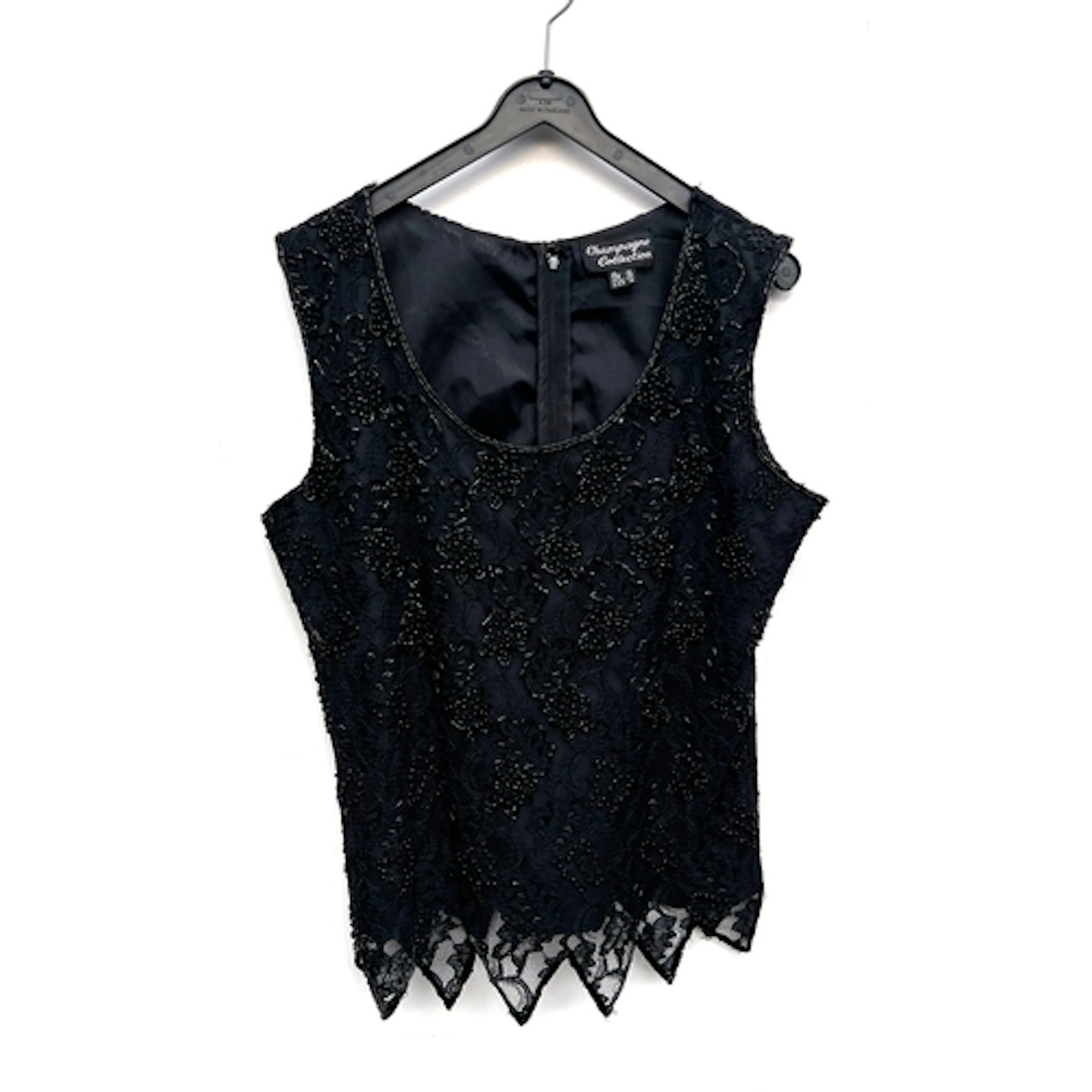 A Champagne Collection black beaded short sleeved top, with ...