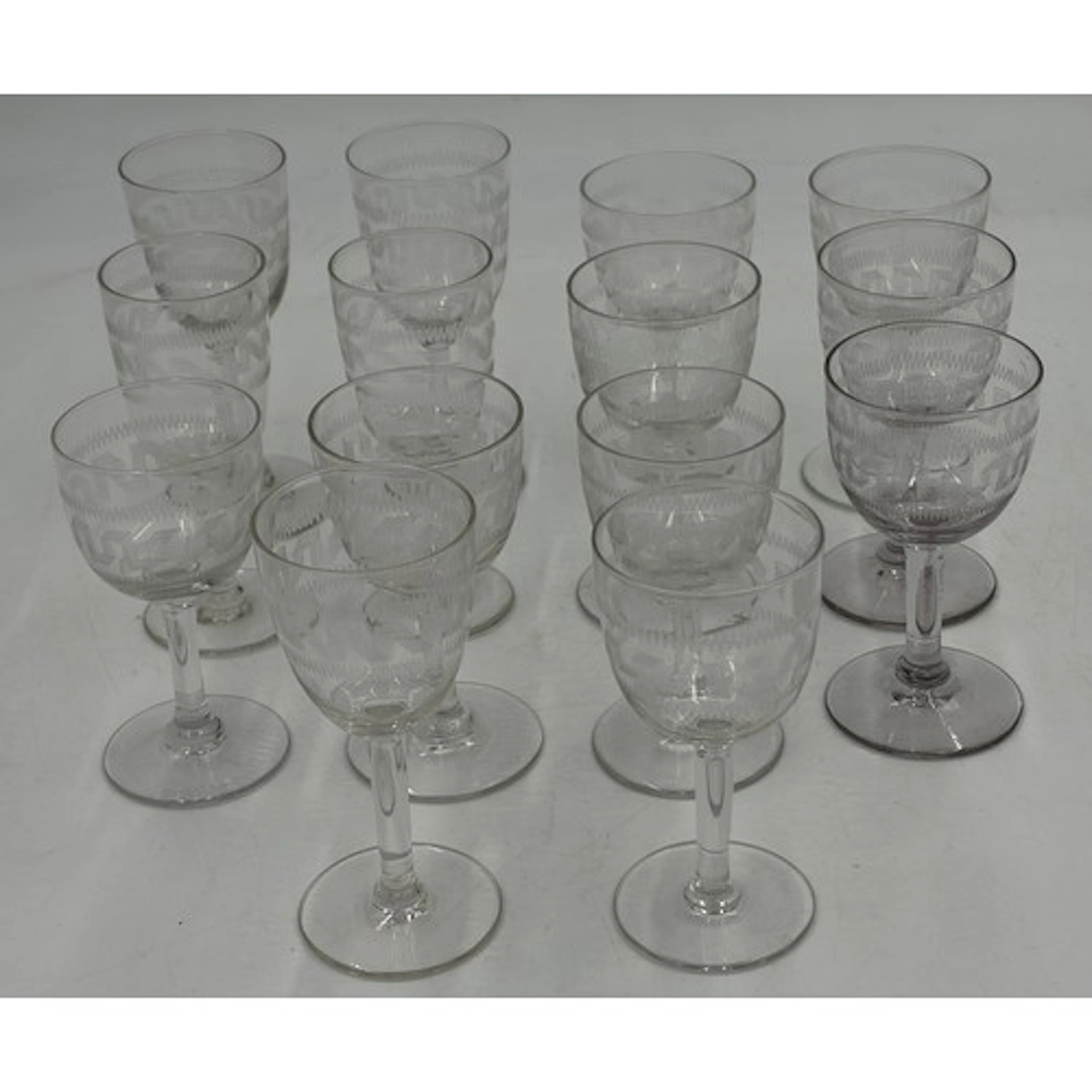 A collection of 14 x Edwardian sherry/port glasses in Greek...