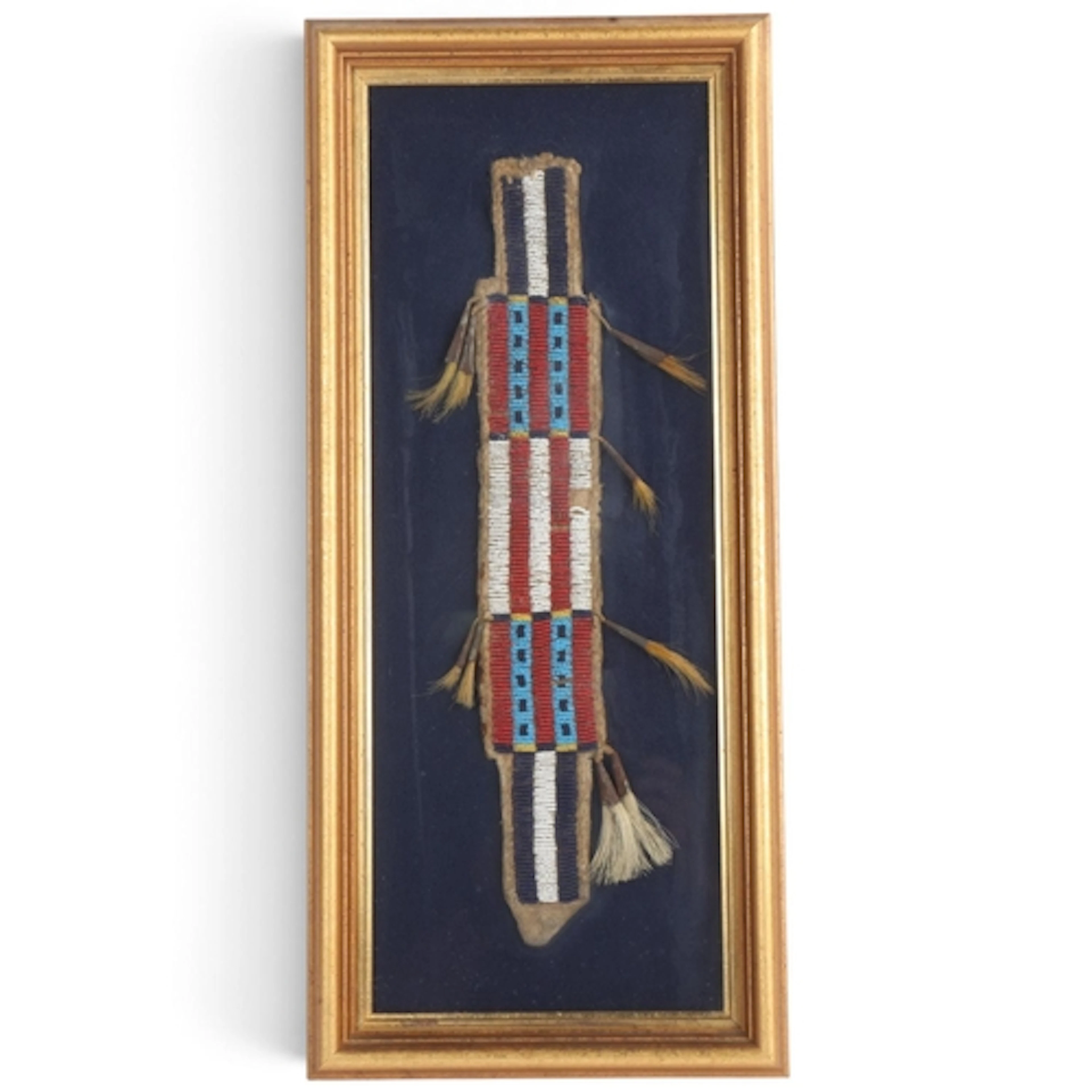 A Plains Native American beaded hide knife cover, length 37c...