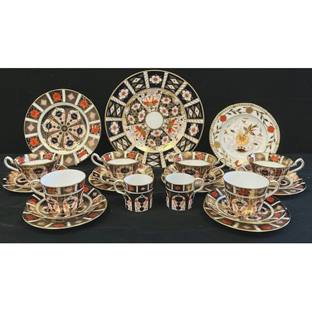 Royal Crown Derby - a set of four footed tea cups and saucer...