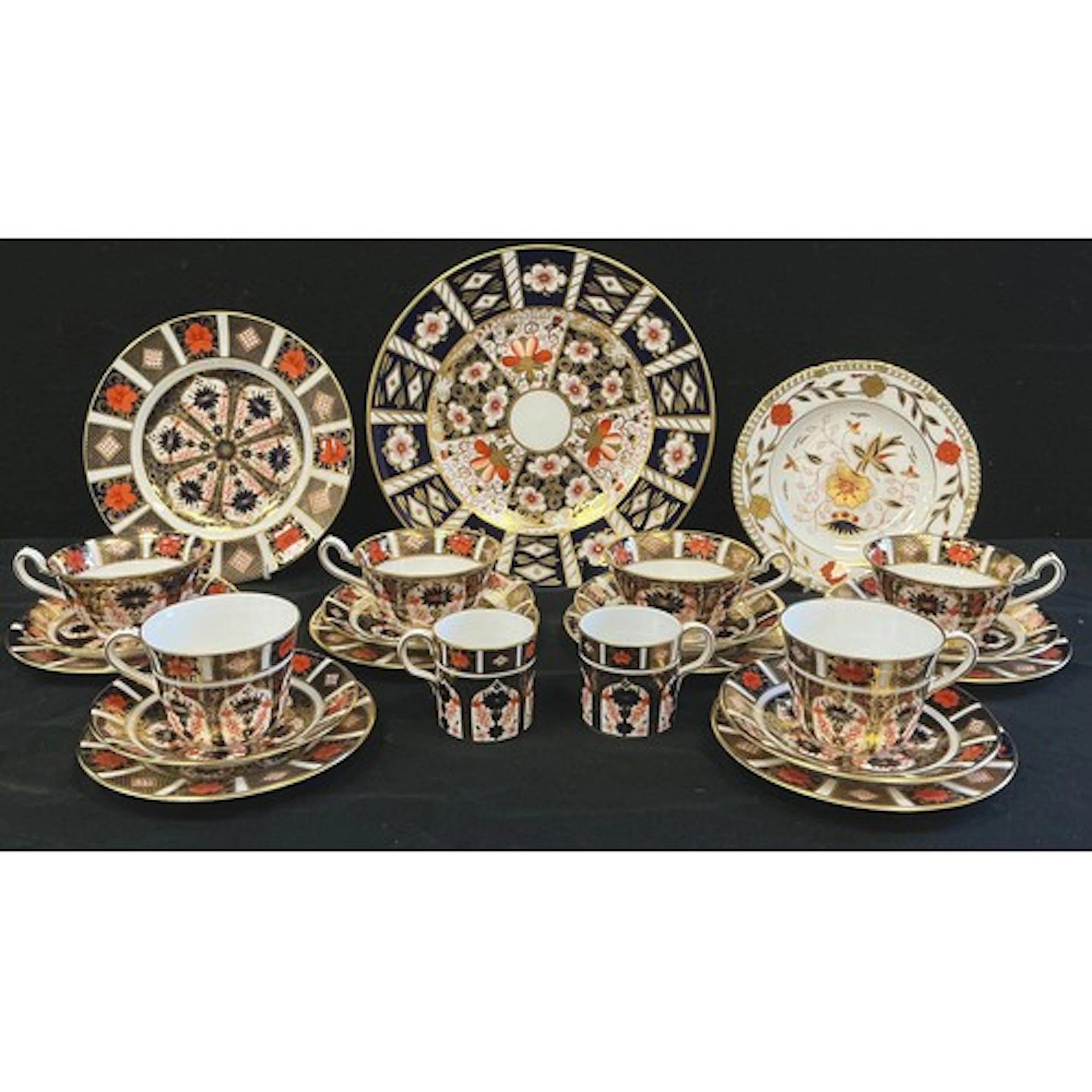 Royal Crown Derby - a set of four footed tea cups and saucer...
